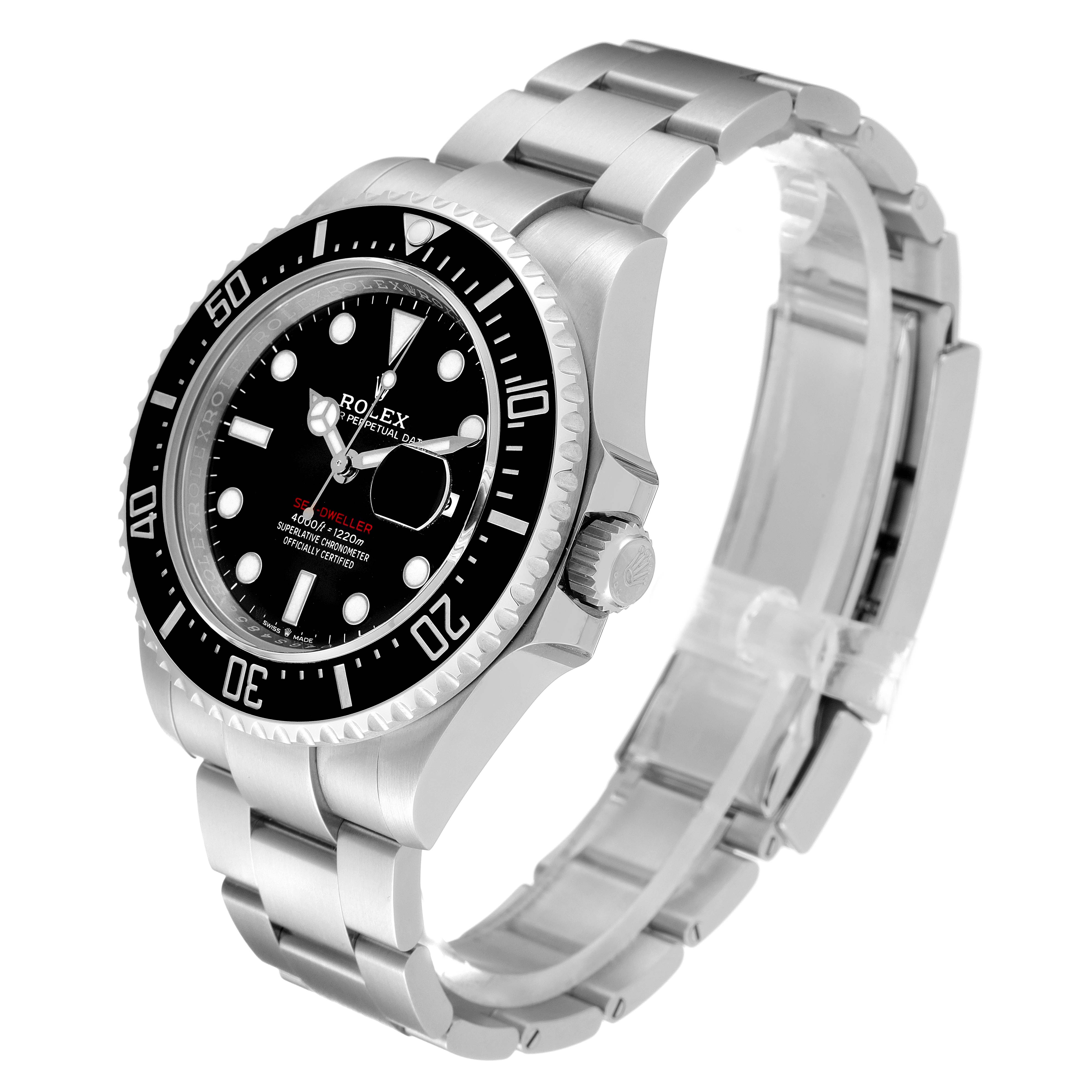 The image shows a Rolex Sea-Dweller 126600 Men
s Stainless Steel Black Dial 126600 Men
s Stainless Steel Black Dial watch from a slight side angle, highlighting its dial, bezel, case, and bracelet.