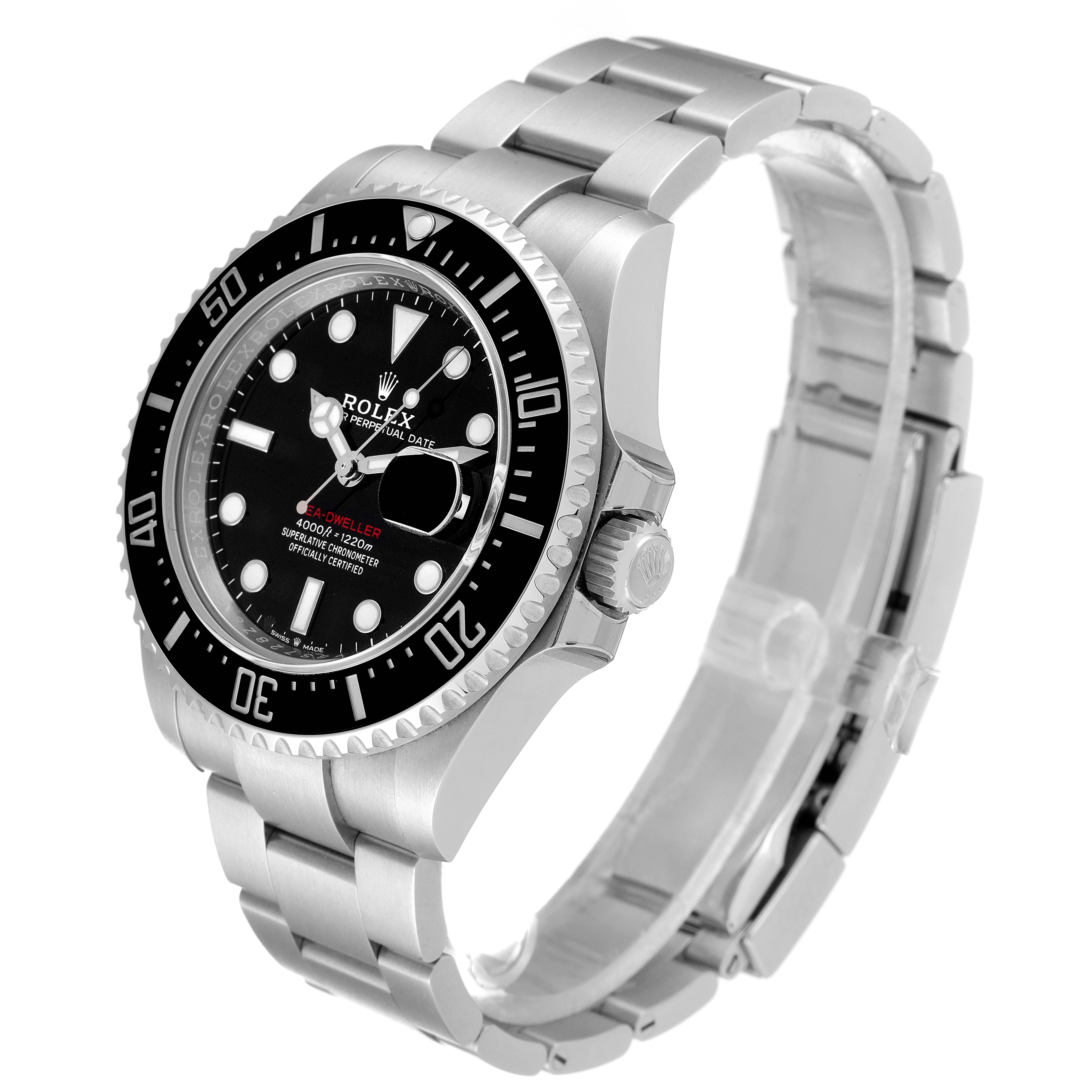 The image shows a three-quarter view of a Rolex Sea-Dweller 126600 Men
s Stainless Steel Black Dial 126600 Men
s Stainless Steel Black Dial watch, highlighting the bezel, dial, crown, and bracelet.