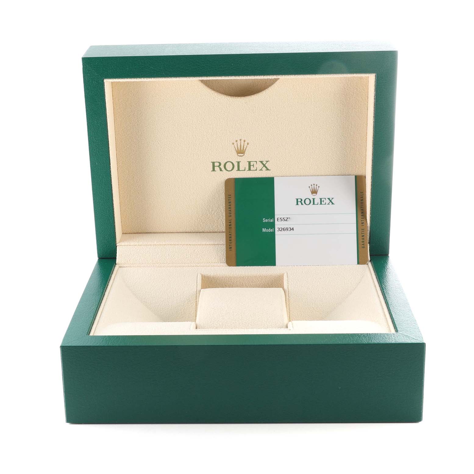 This image shows the open watch box for a Rolex Sky-Dweller 326934 Men's Stainless Steel Blue Dial 326934 Men's Stainless Steel Blue Dial, including the warranty card and empty watch cushion.