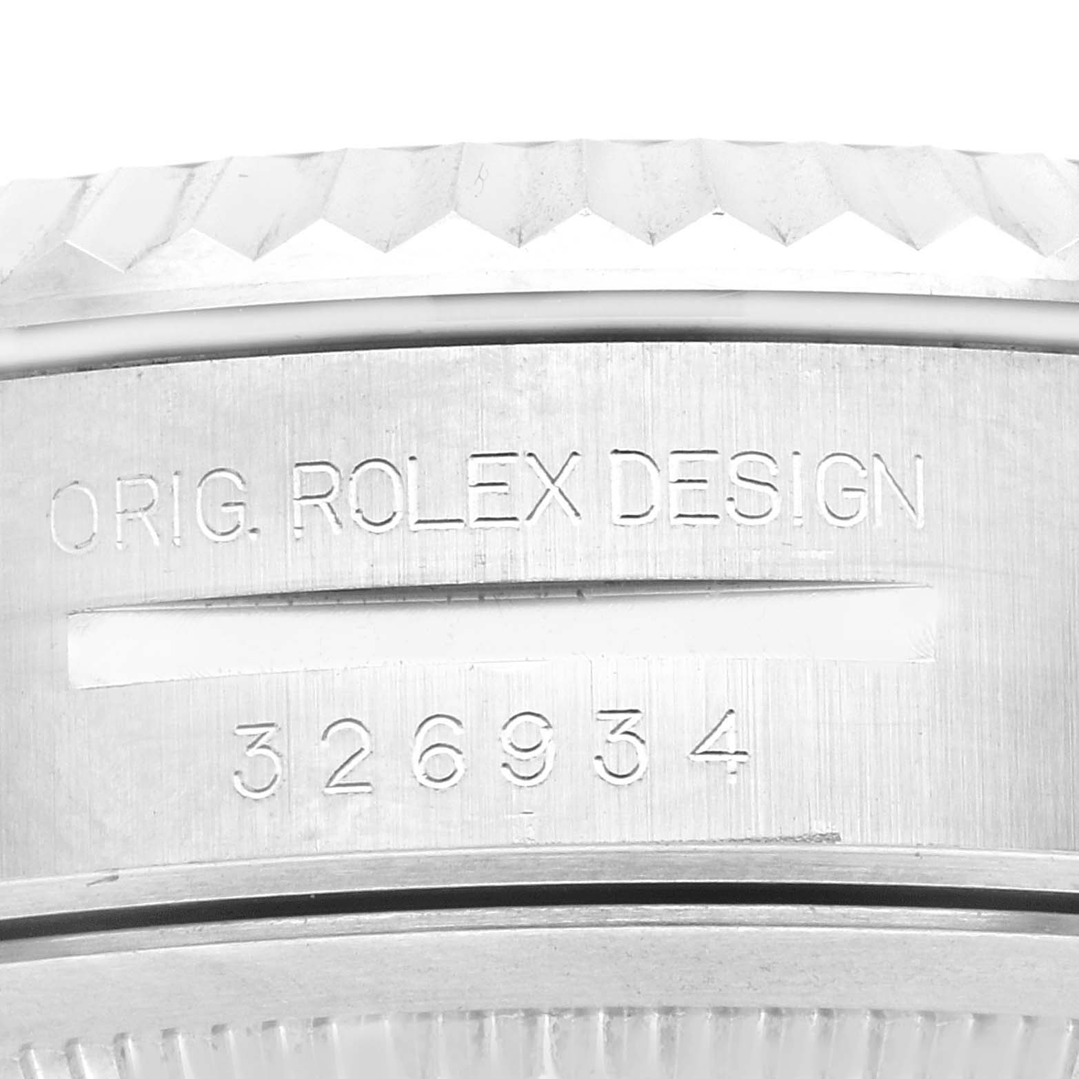 This image shows a close-up of the side of a Rolex Sky-Dweller 326934 Men's Stainless Steel Blue Dial 326934 Men's Stainless Steel Blue Dial watch, highlighting the engraved serial number and "ORIG. ROLEX DESIGN."