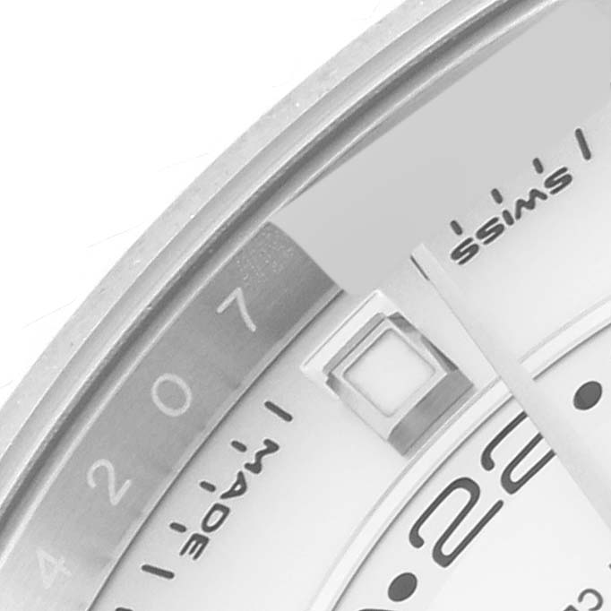 This image shows a close-up of the dial and part of the bezel of a Rolex Sky-Dweller 326934 Men
s Stainless Steel White Dial 326934 Men
s Stainless Steel White Dial watch.