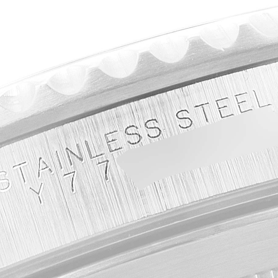 Close-up of the stainless steel bezel and engraved details on a Rolex Submariner 14060 Men
s Stainless Steel Black Dial 14060 Men
s Stainless Steel Black Dial watch.