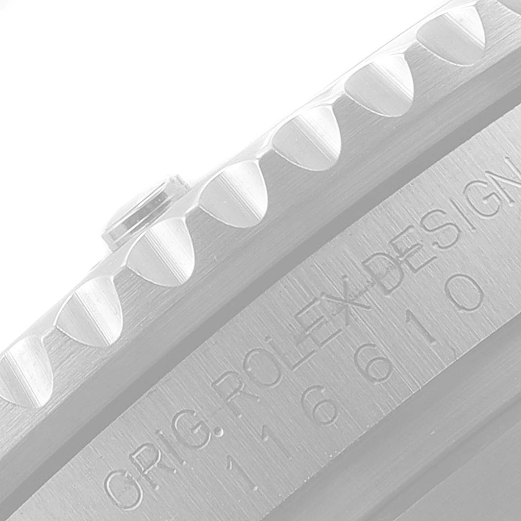 This image shows a close-up of the bezel edge and engraved serial number part of the Rolex Submariner 116610LV Men
s Stainless Steel Green Dial 116610LV Men
s Stainless Steel Green Dial watch.