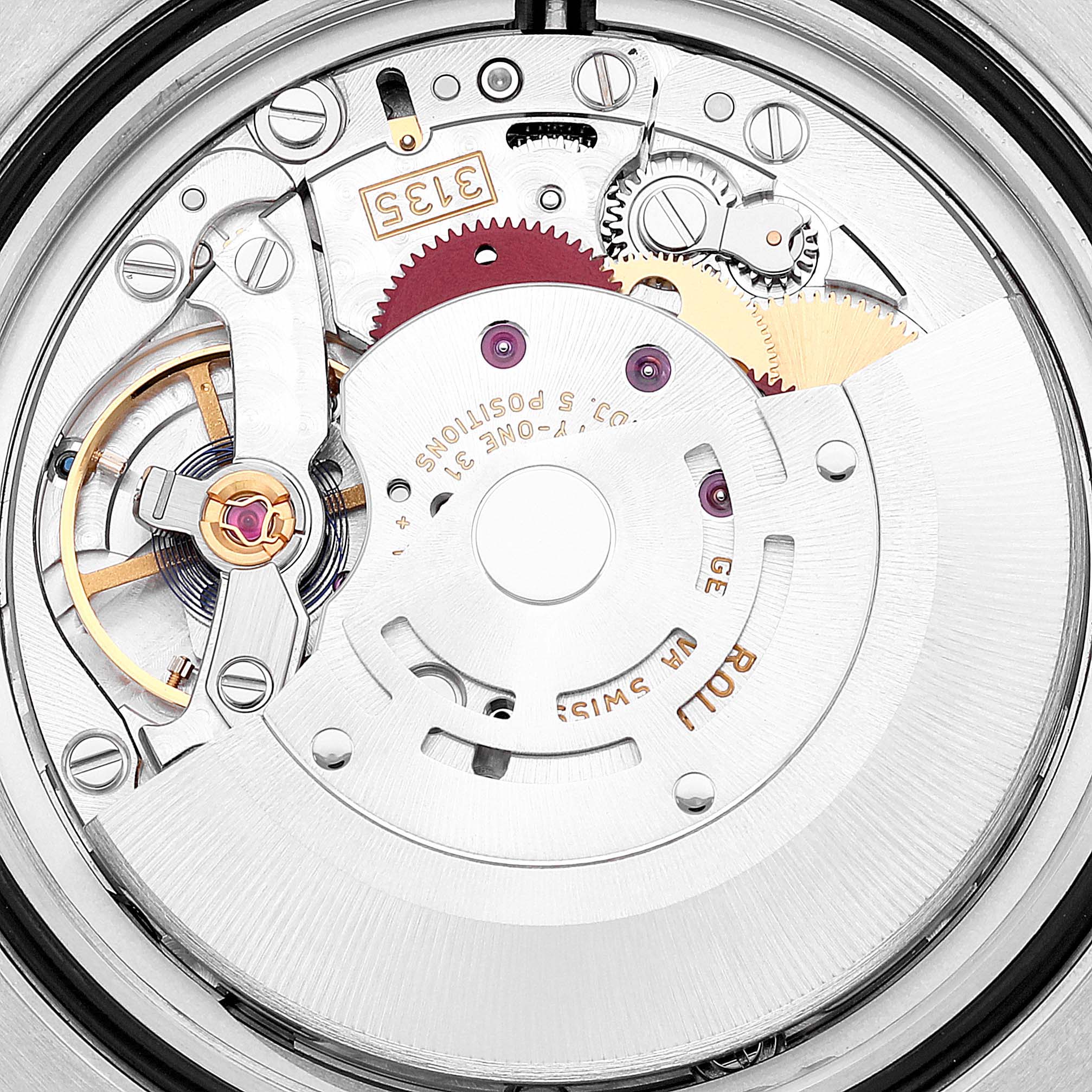 The image shows the intricate internal movement of a Rolex Submariner 116610LV Men
s Stainless Steel Green Dial 116610LV Men
s Stainless Steel Green Dial watch at a close-up angle.