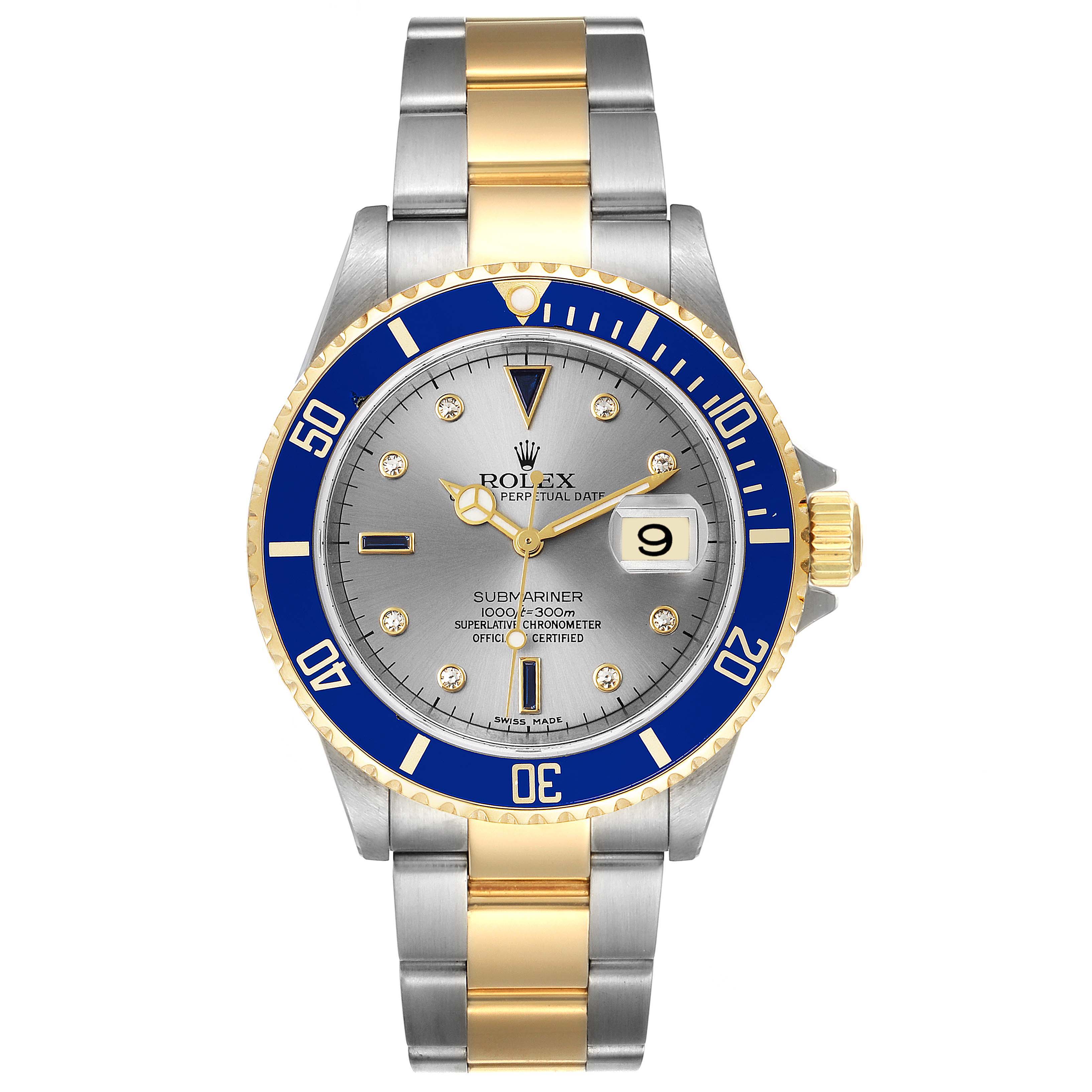 The image shows a front view of a Rolex Submariner 16613 Men
s Steel and Gold (two tone) Grey Dial 16613 Men
s Steel and Gold (two tone) Grey Dial watch featuring a blue bezel, gray dial, and stainless steel and gold bracelet.