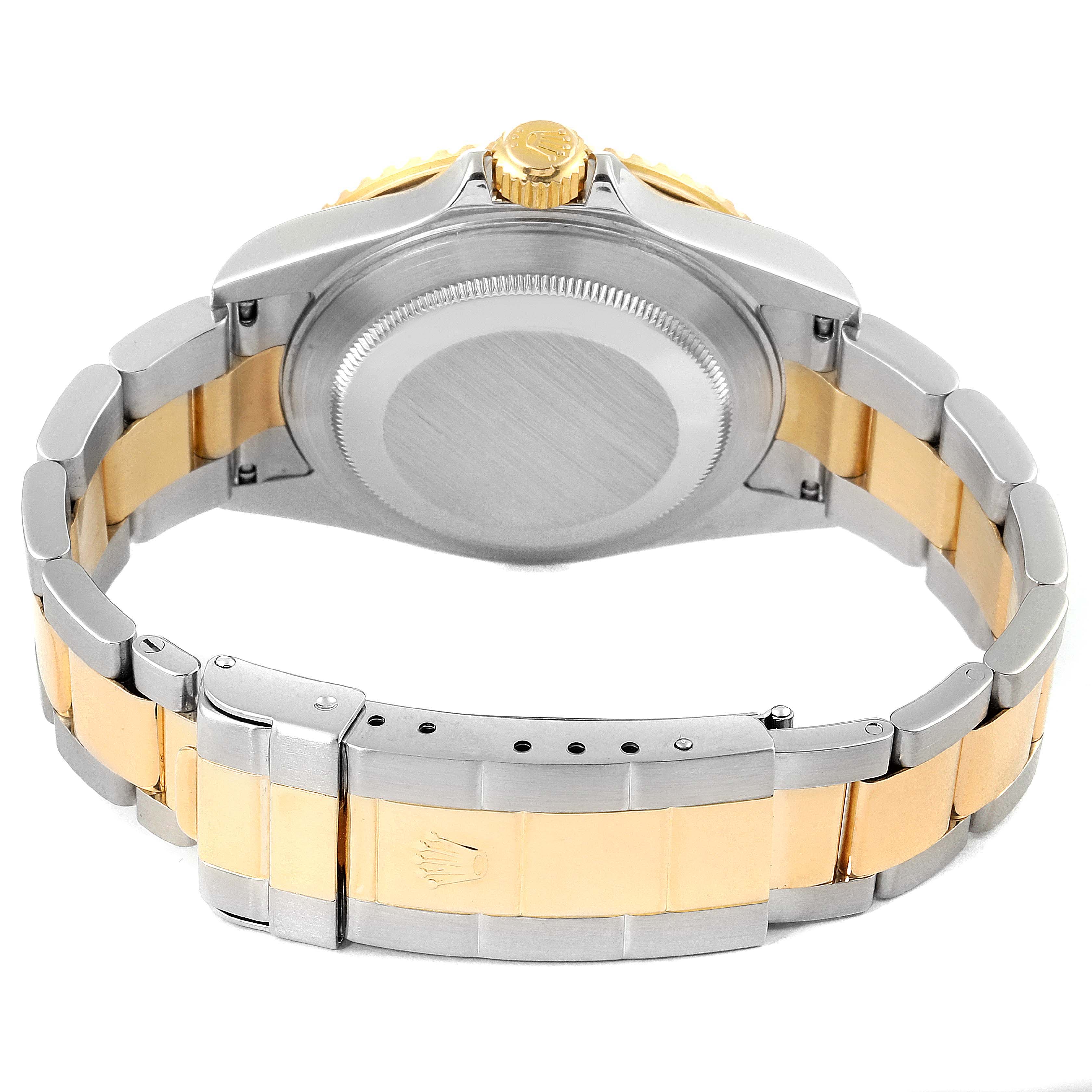 The image shows the case back and bracelet clasp of a Rolex Submariner 16613 Men
s Steel and Gold (two tone) Grey Dial 16613 Men
s Steel and Gold (two tone) Grey Dial watch from a rear angle.