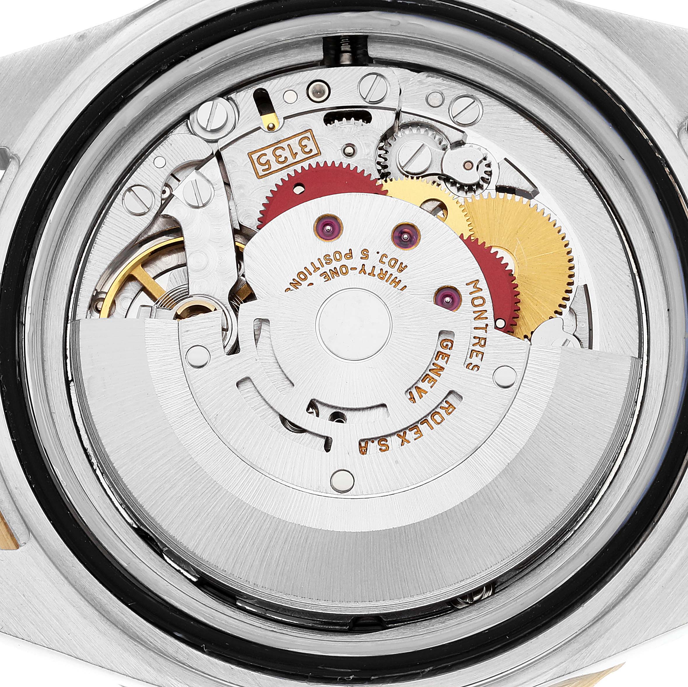 This image shows the inner movement mechanism of a Rolex Submariner 16613 Men's Steel and Gold (two tone) Grey Dial 16613 Men's Steel and Gold (two tone) Grey Dial watch from a rear view angle.