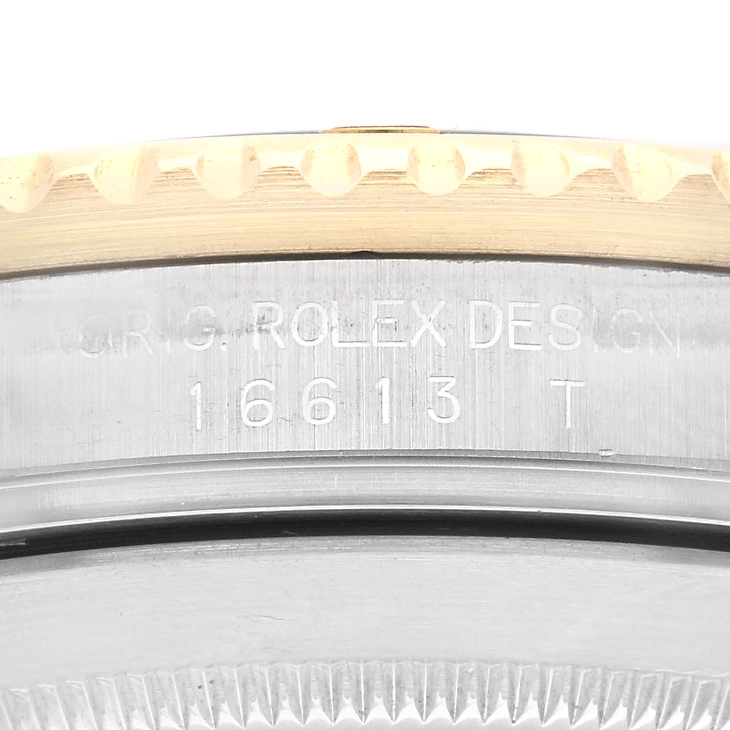 The image shows a close-up of the edge and the engraved case back of a Rolex Submariner 16613 Men's Steel and Gold (two tone) Black Dial 16613 Men's Steel and Gold (two tone) Black Dial, model number 16613.