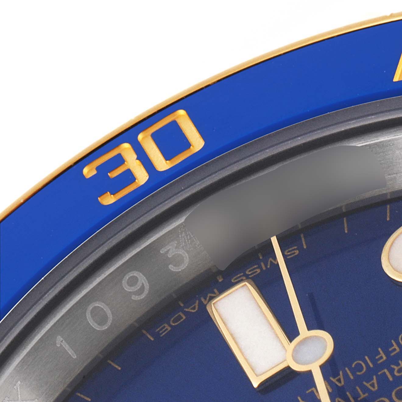 Close-up of the Rolex Submariner 116613 Men's Steel and Gold (two tone) Blue Dial 116613 Men's Steel and Gold (two tone) Blue Dial watch, showcasing its blue bezel with a "30" mark and part of the dial with hour markers.
