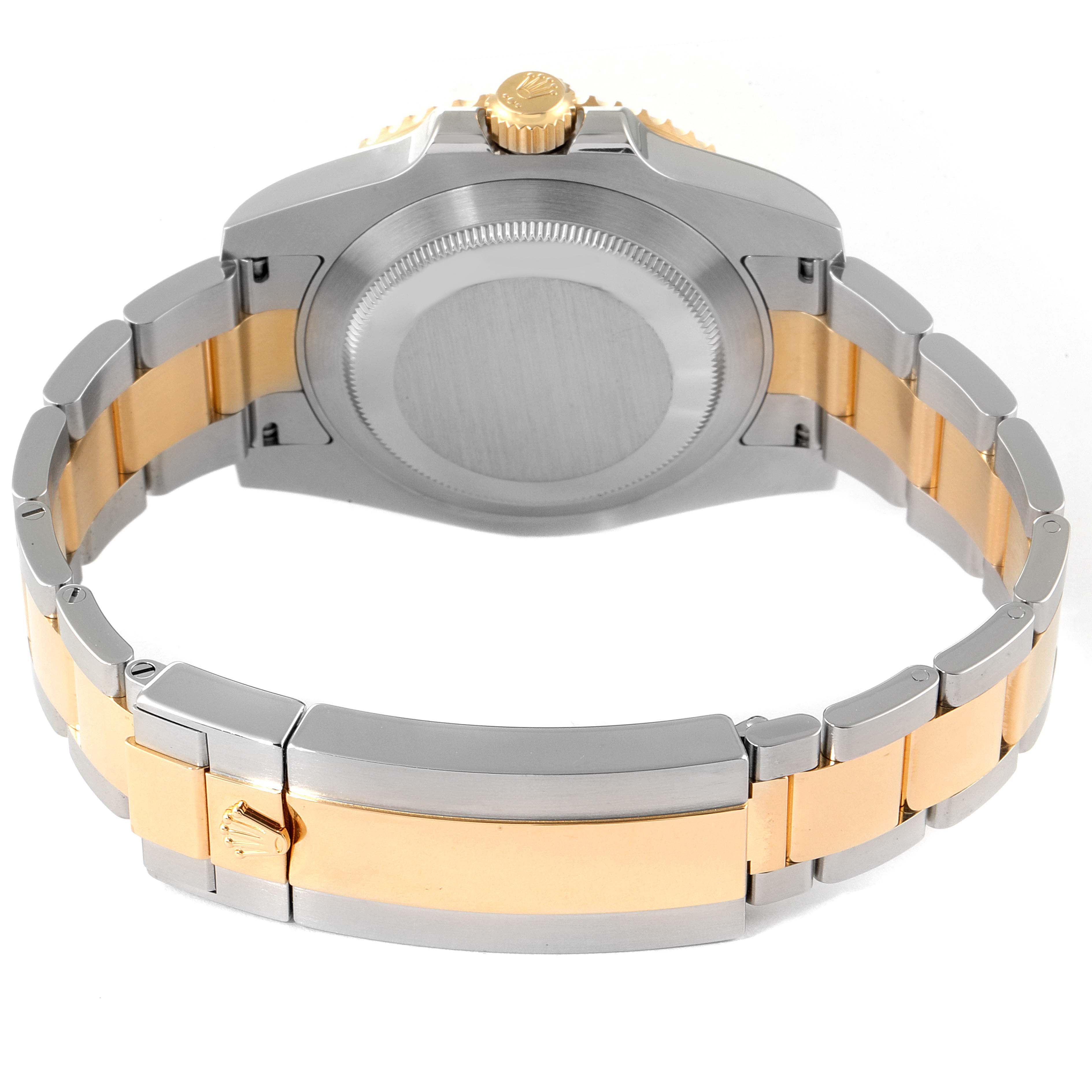 The image shows the back view of a Rolex Submariner 116613 Men's Steel and Gold (two tone) Blue Dial 116613 Men's Steel and Gold (two tone) Blue Dial, revealing its case back, crown, and bi-metal bracelet.