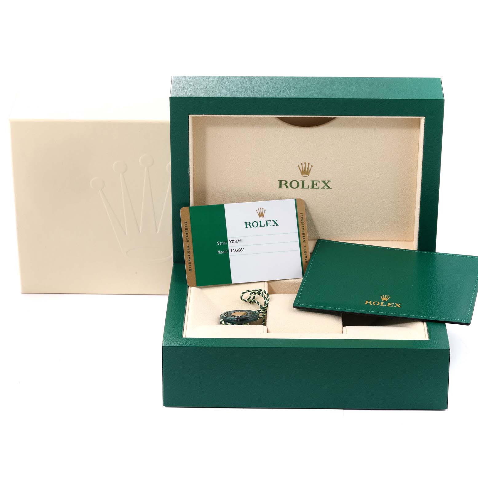 The image shows a Rolex Yacht-Master 116681 Men
s Steel and Gold (two tone) White Dial 116681 Men
s Steel and Gold (two tone) White Dial watch box and accessories, including a warranty card and green booklet.