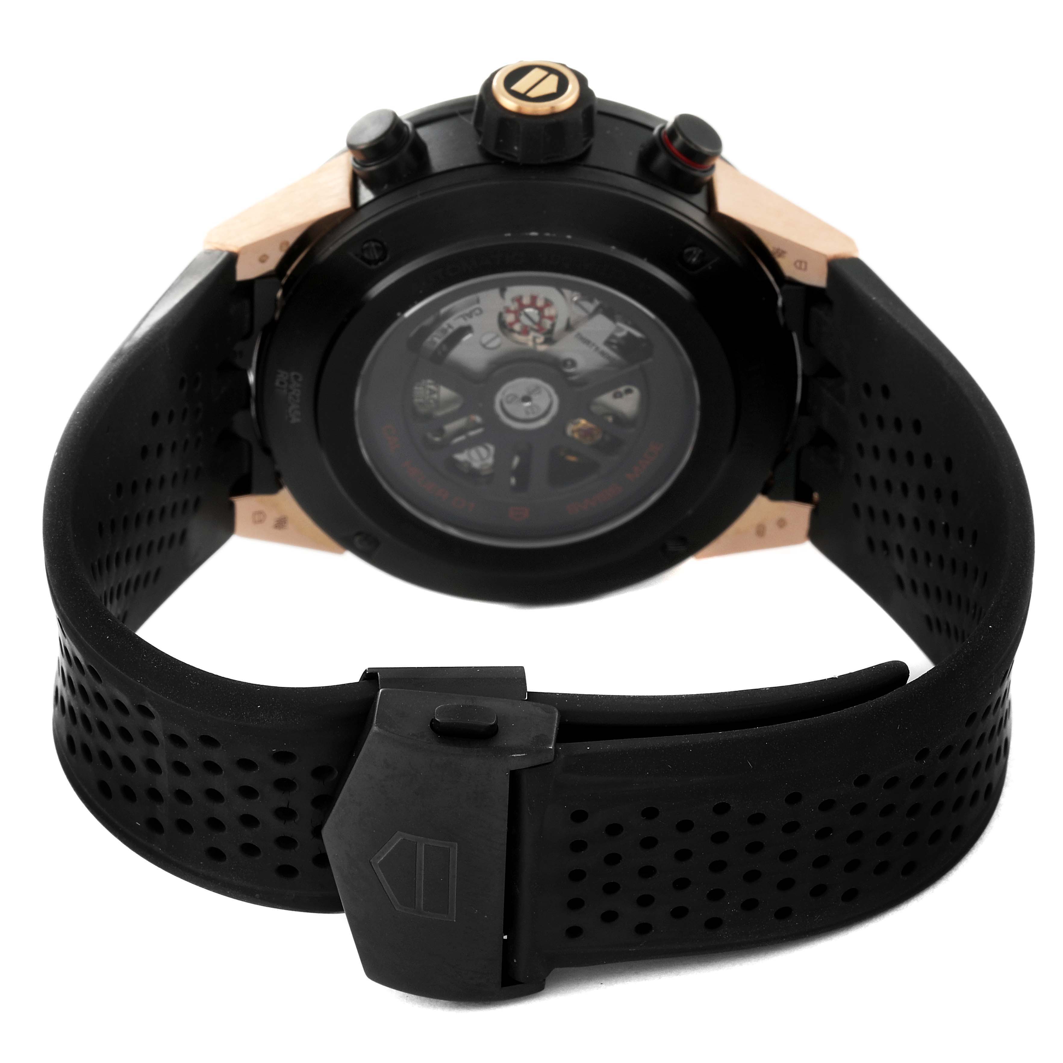 The image shows the back view of a Tag Heuer Carrera CAR2A5A.FT6044 Men's Titanium Black Dial CAR2A5A.FT6044 Men's Titanium Black Dial watch, highlighting the transparent case back, crown, and perforated rubber strap.