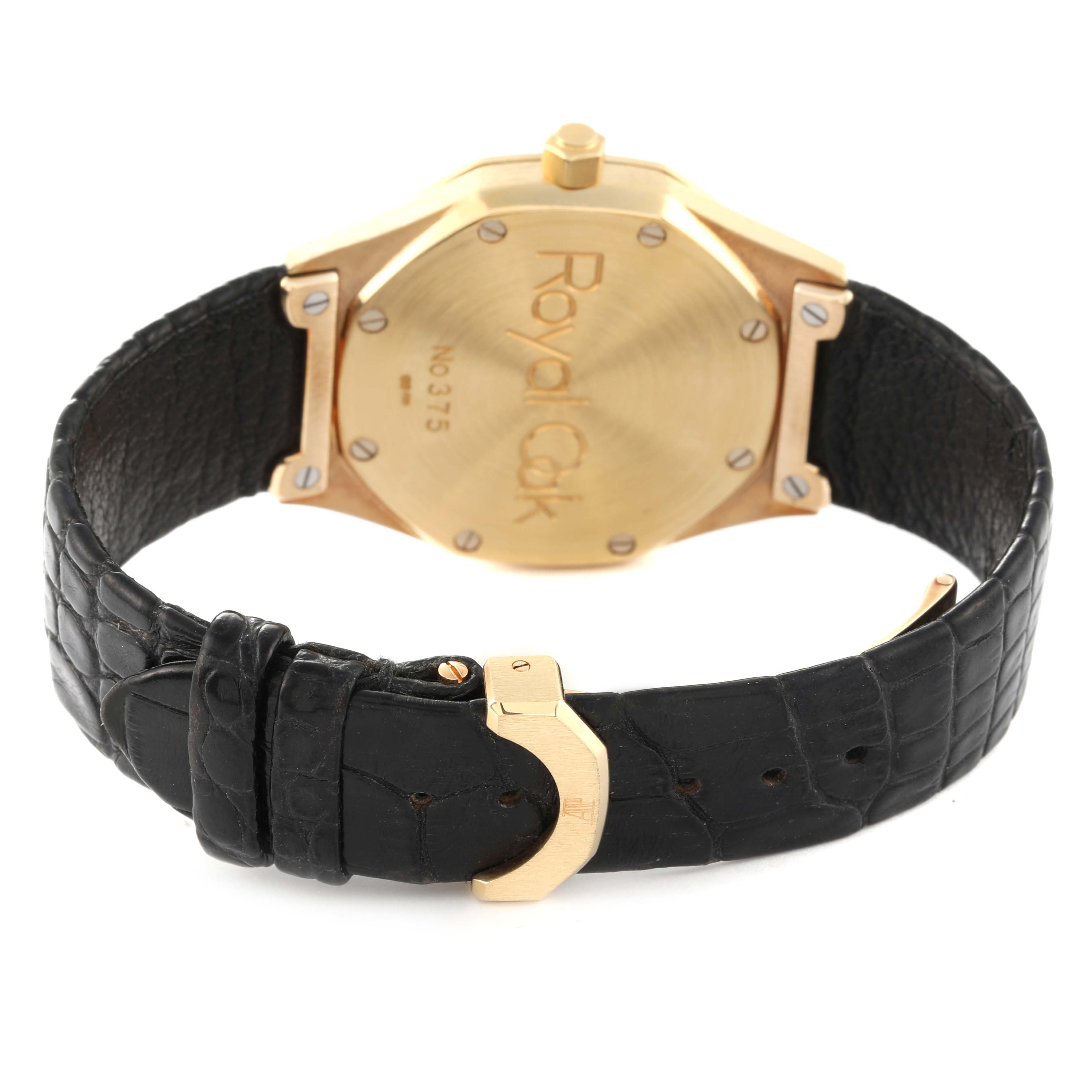 This image shows the back case and leather strap of an Audemars Piguet Royal Oak 14808BA Men's Yellow Gold Beige Dial 14808BA Men's Yellow Gold Beige Dial watch from a rear angle.