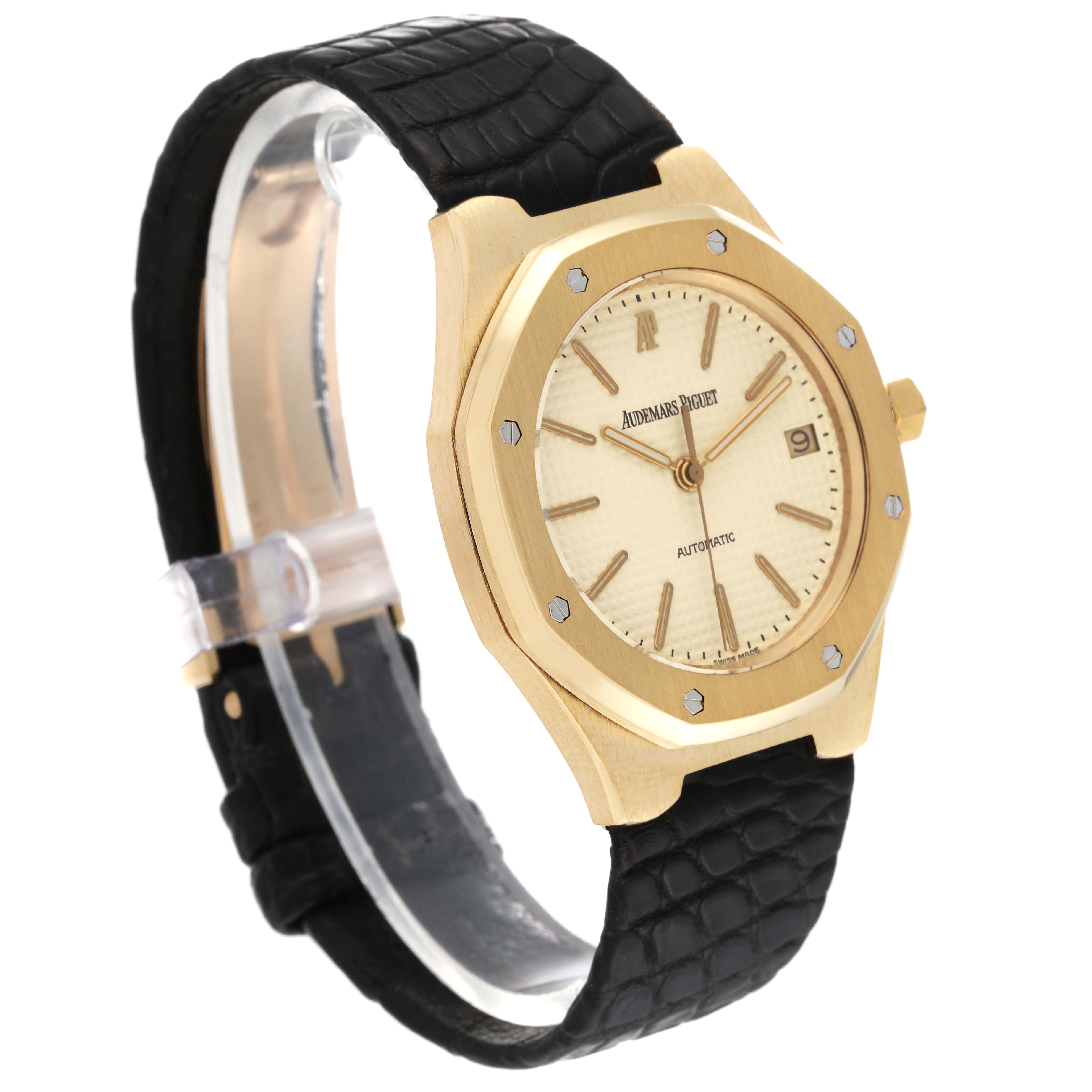The image shows a side angle of the Audemars Piguet Royal Oak 14808BA Men's Yellow Gold Beige Dial 14808BA Men's Yellow Gold Beige Dial watch, featuring the case, dial, and leather strap.