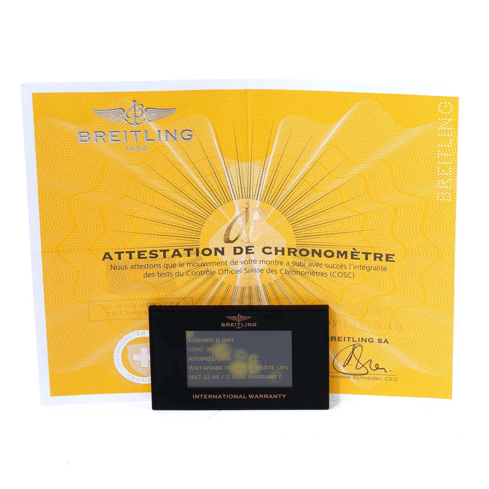 The Breitling Avenger A3239011-C872-170A Men's Stainless Steel Mother of Pearl Dial A3239011-C872-170A Men's Stainless Steel Mother of Pearl Dial model watch accessories shown include an international warranty card and a certificate of chronometer attestation.