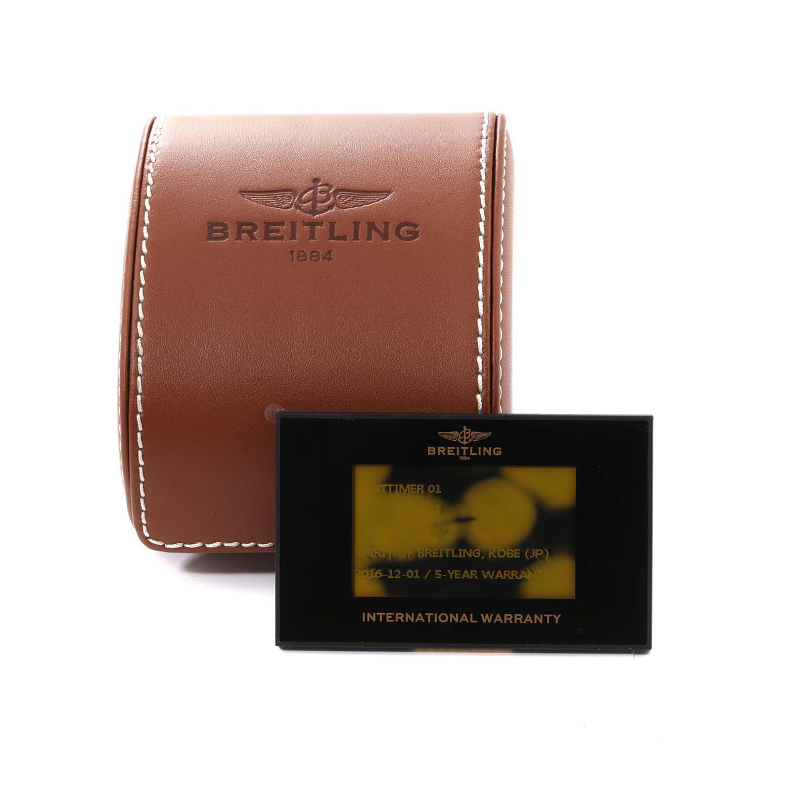 The image shows a leather Breitling Navitimer AB0120 Men
s Stainless Steel Black Dial AB0120 Men
s Stainless Steel Black Dial watch case and an international warranty card.