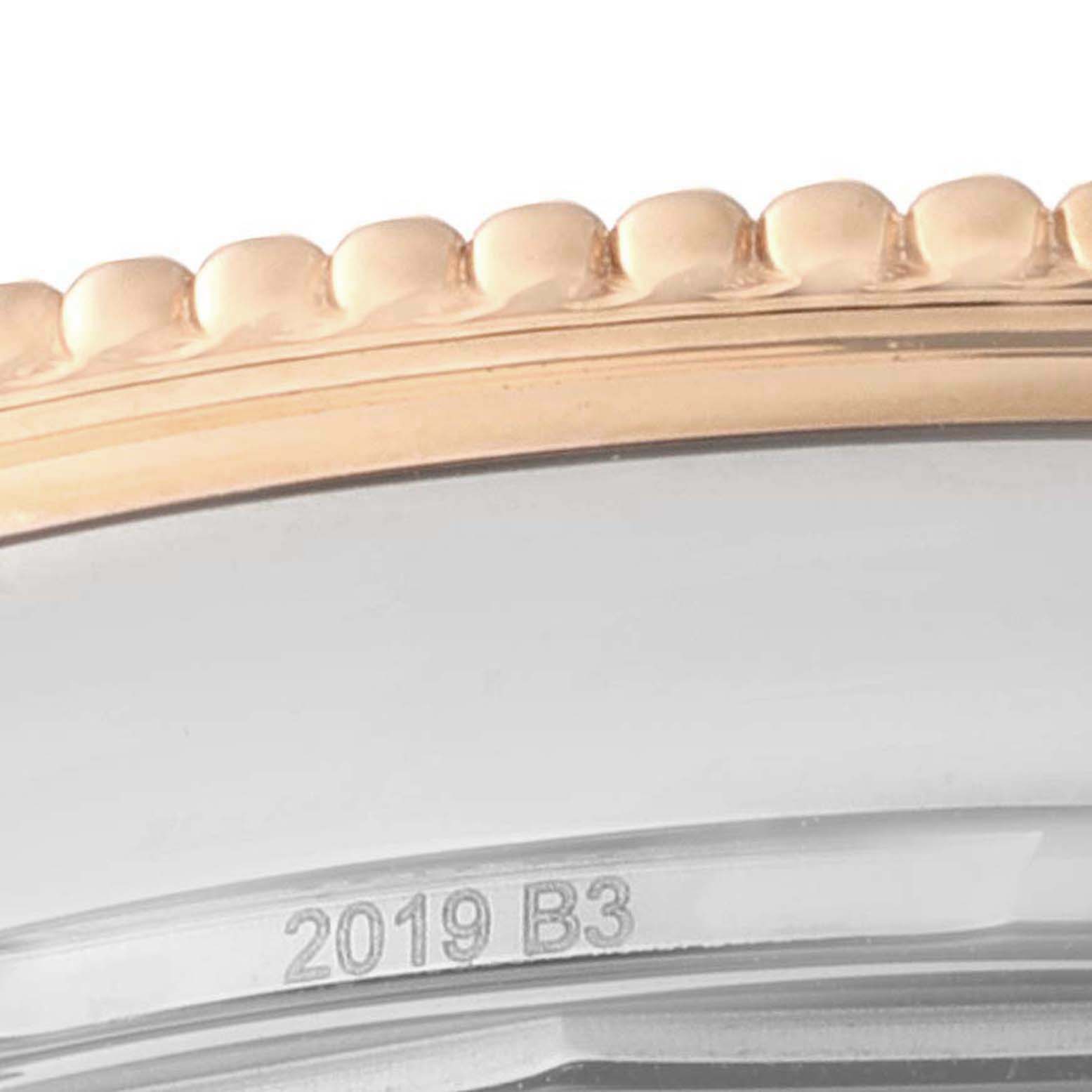 This image shows a close-up of the bezel and part of the case of a Breitling Navitimer U17326 Men's Steel and Gold (two tone) Silver Dial U17326 Men's Steel and Gold (two tone) Silver Dial watch.