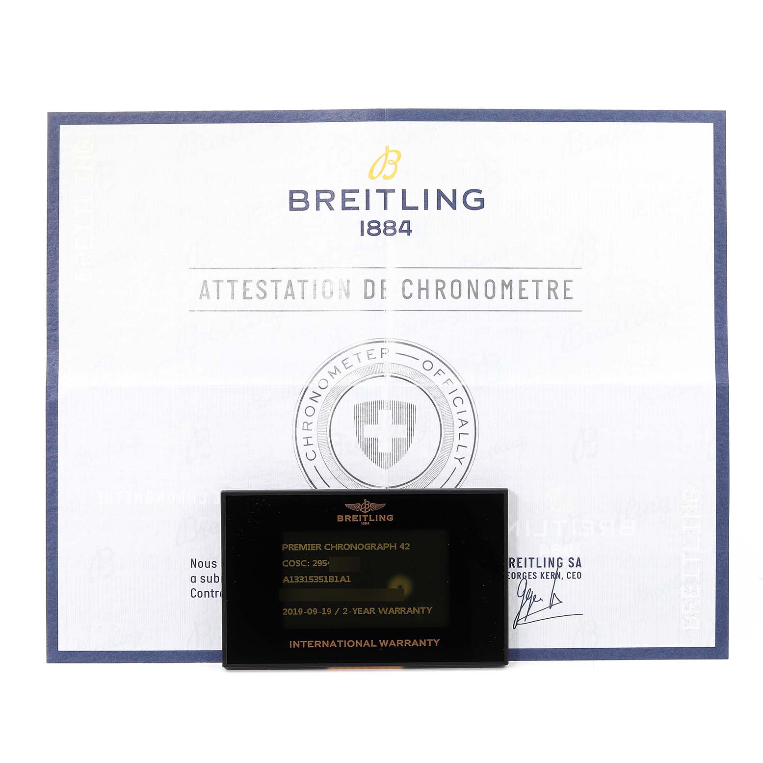 This image shows the warranty card and chronometer certificate for the Breitling Premier A13315 Men's Stainless Steel Black Dial A13315 Men's Stainless Steel Black Dial model.