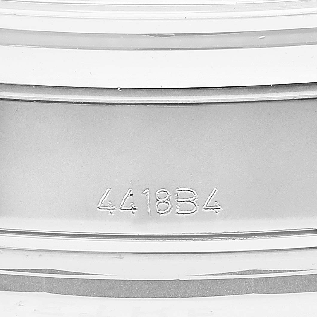 This image shows a close-up of the case back of a Premier model by Breitling with the numbers "4418B4" engraved.