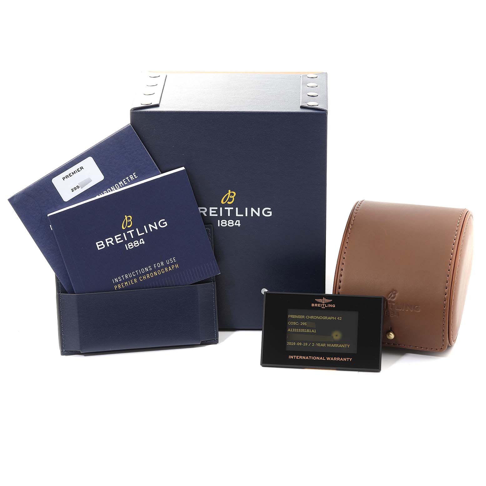 The image shows the packaging and accessories for a Breitling Premier A13315 Men's Stainless Steel Black Dial A13315 Men's Stainless Steel Black Dial model watch, including manuals, a warranty card, and a leather case.