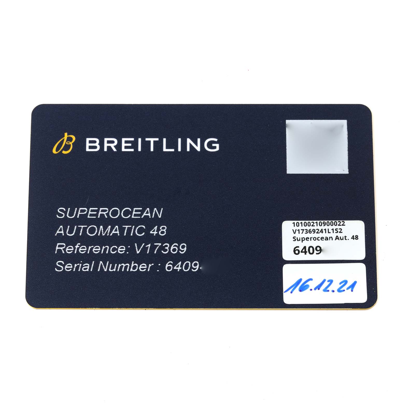 The image shows a Breitling Superocean V17369 Men's Titanium Green Dial V17369 Men's Titanium Green Dial model warranty card detailing model, reference, and serial numbers.