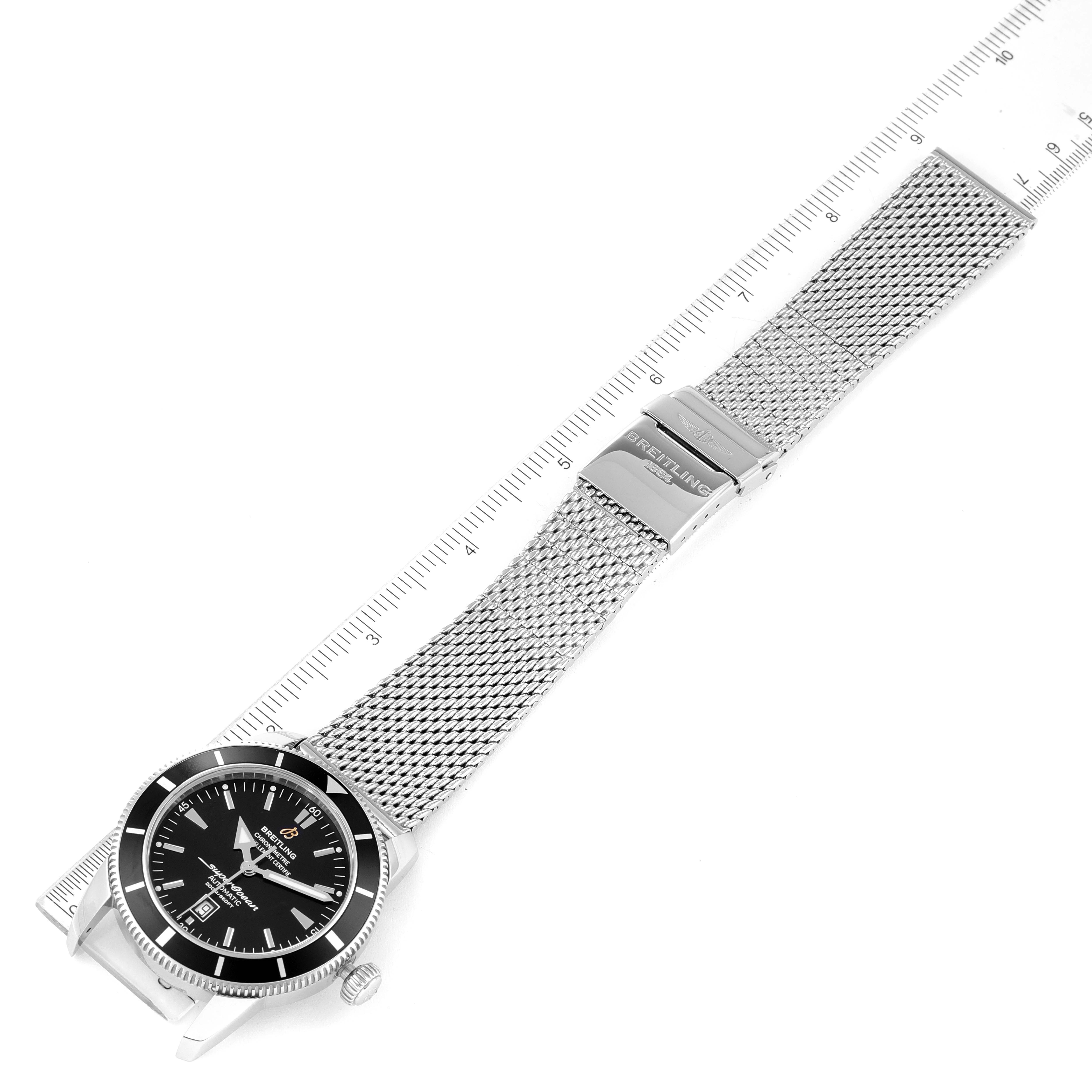 The image shows a top-down view of a Breitling Superocean A17320 Men's Stainless Steel Black Dial A17320 Men's Stainless Steel Black Dial watch with a mesh stainless steel strap and clasp.
