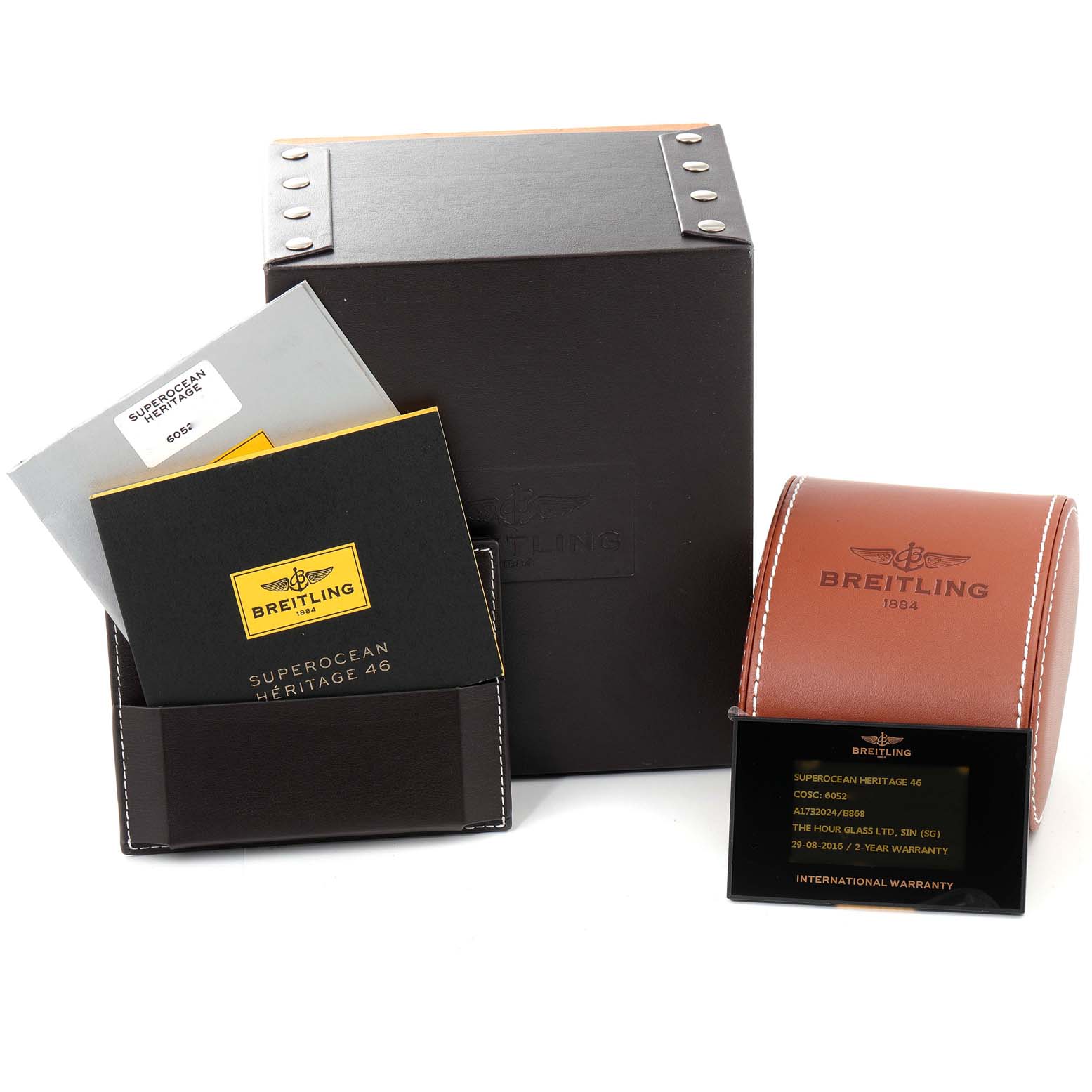 This image shows the packaging and warranty documents for a Breitling Superocean A17320 Men's Stainless Steel Black Dial A17320 Men's Stainless Steel Black Dial Heritage 46 watch.