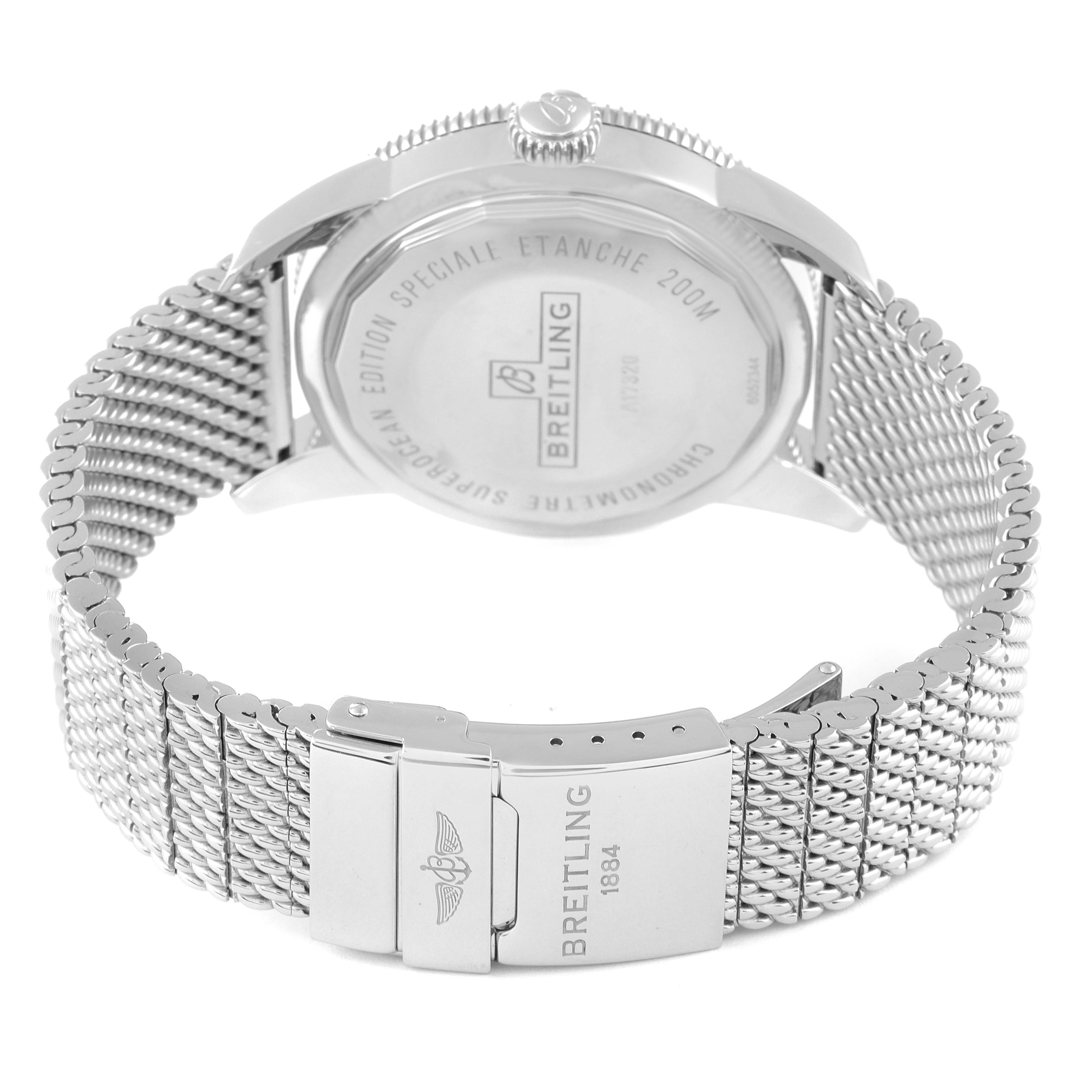 The image shows the back of a Breitling Superocean A17320 Men's Stainless Steel Black Dial A17320 Men's Stainless Steel Black Dial watch with a focus on its mesh bracelet and clasp.