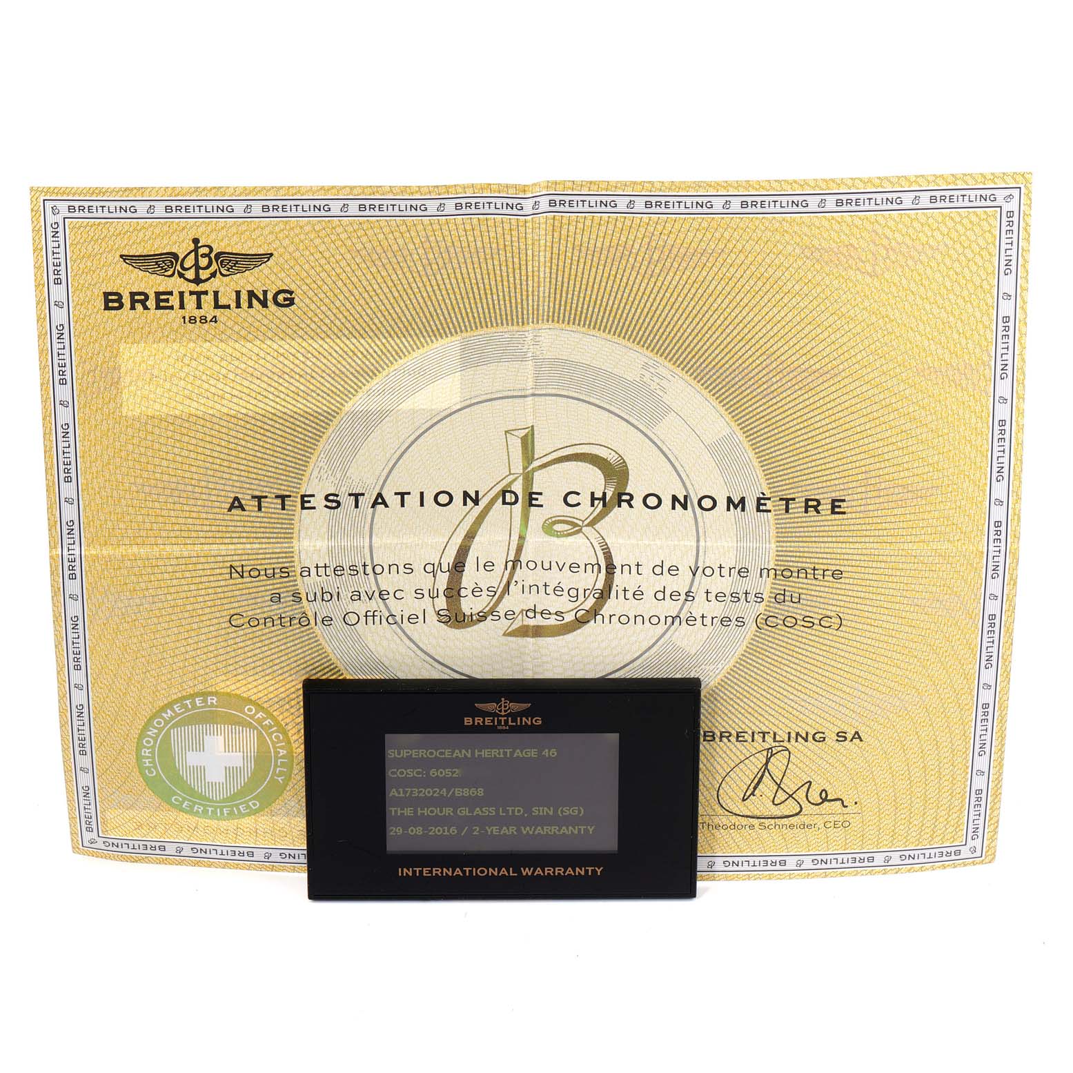 The image shows a Breitling Superocean A17320 Men's Stainless Steel Black Dial A17320 Men's Stainless Steel Black Dial model warranty card and chronometer certificate from a frontal angle.