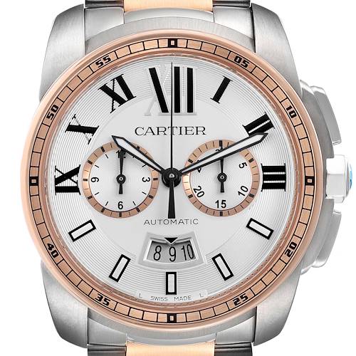 The image shows a close-up of the Cartier Calibre de Cartier W7100042 Men's Stainless Steel Silver Dial watch face, highlighting its dials, numbers, and bezel.