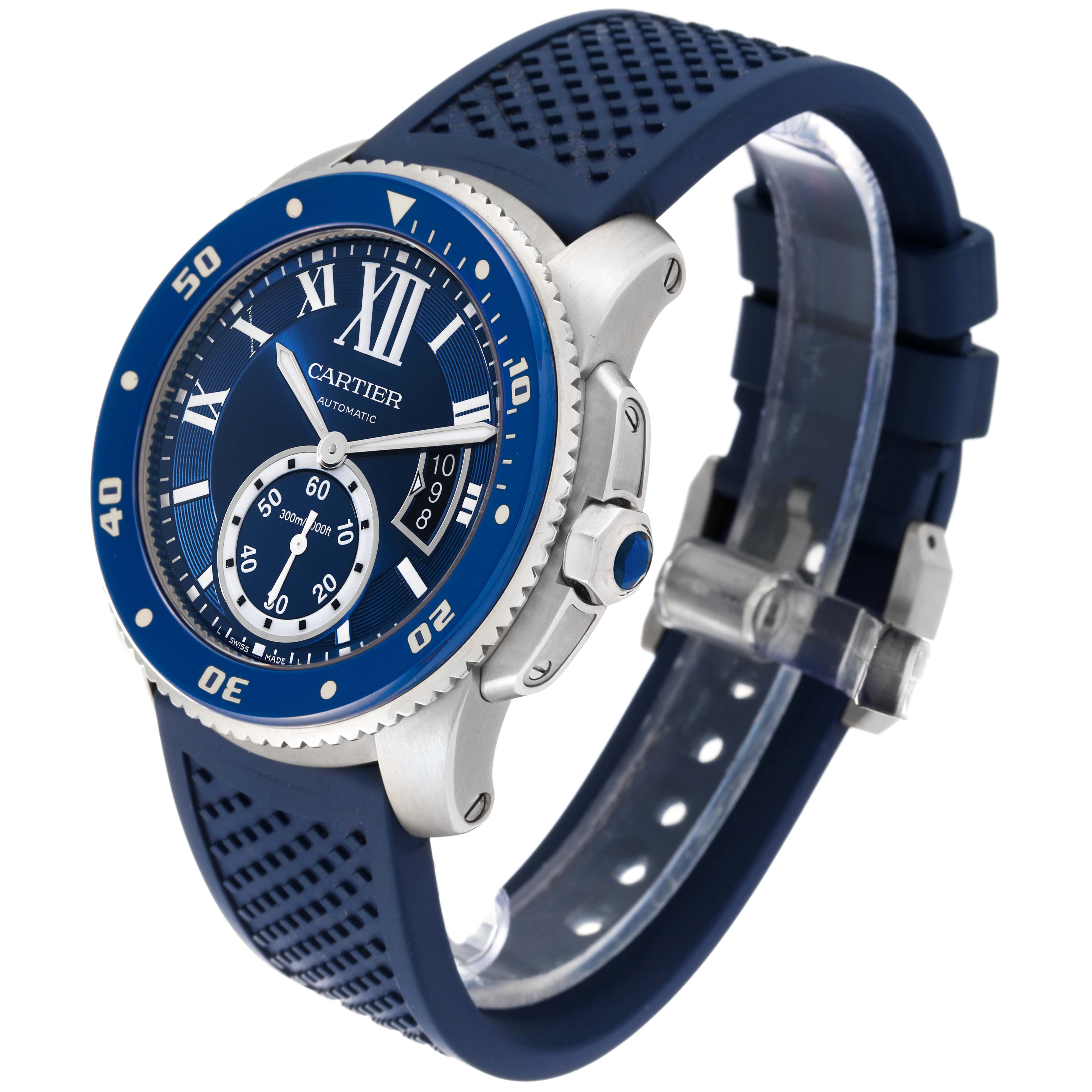 The image shows a Calibre de Cartier watch by Cartier from an angled side and front view, featuring a blue strap and bezel.