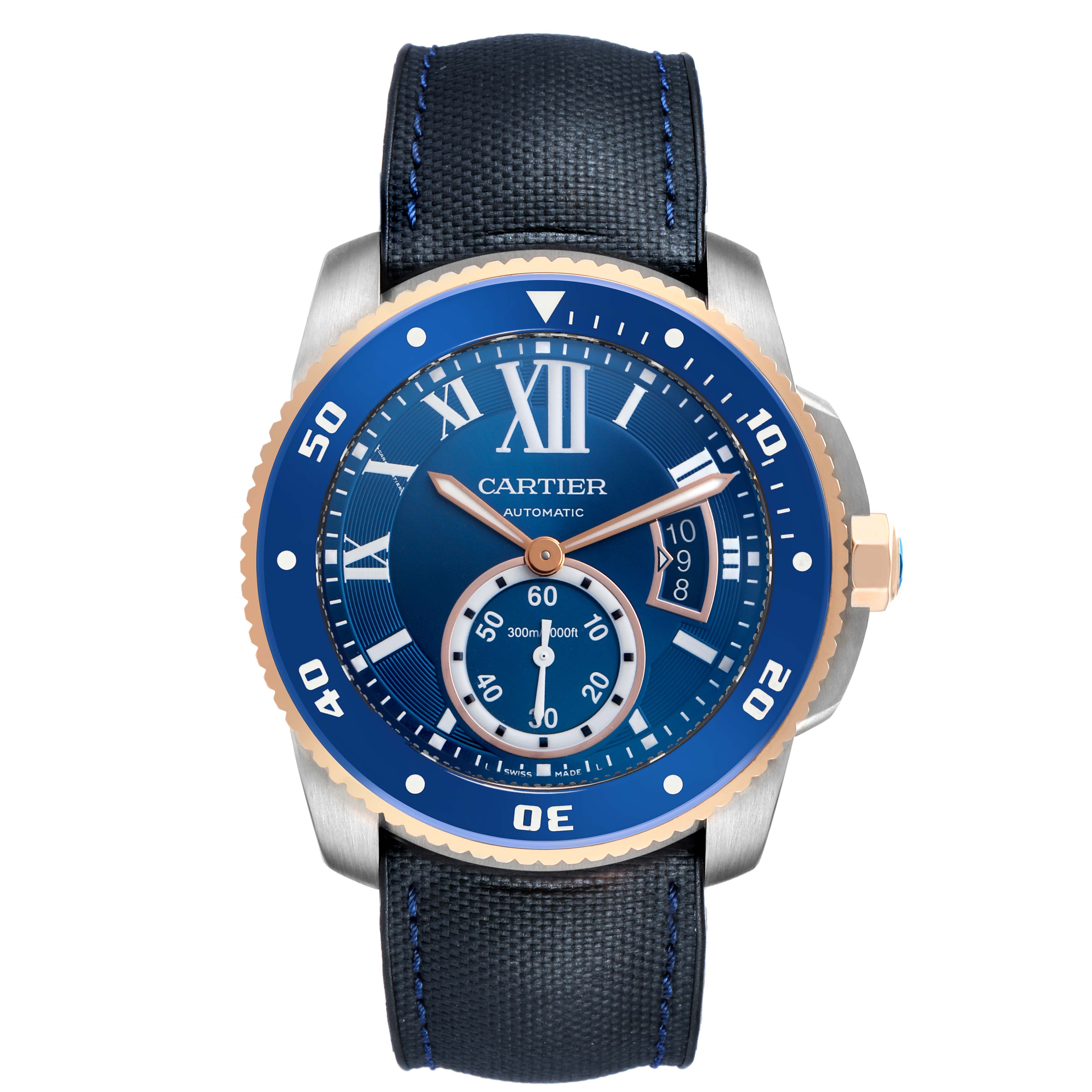The Calibre de Cartier watch is shown from a front angle, displaying its blue dial, bezel, and black strap with blue stitching.