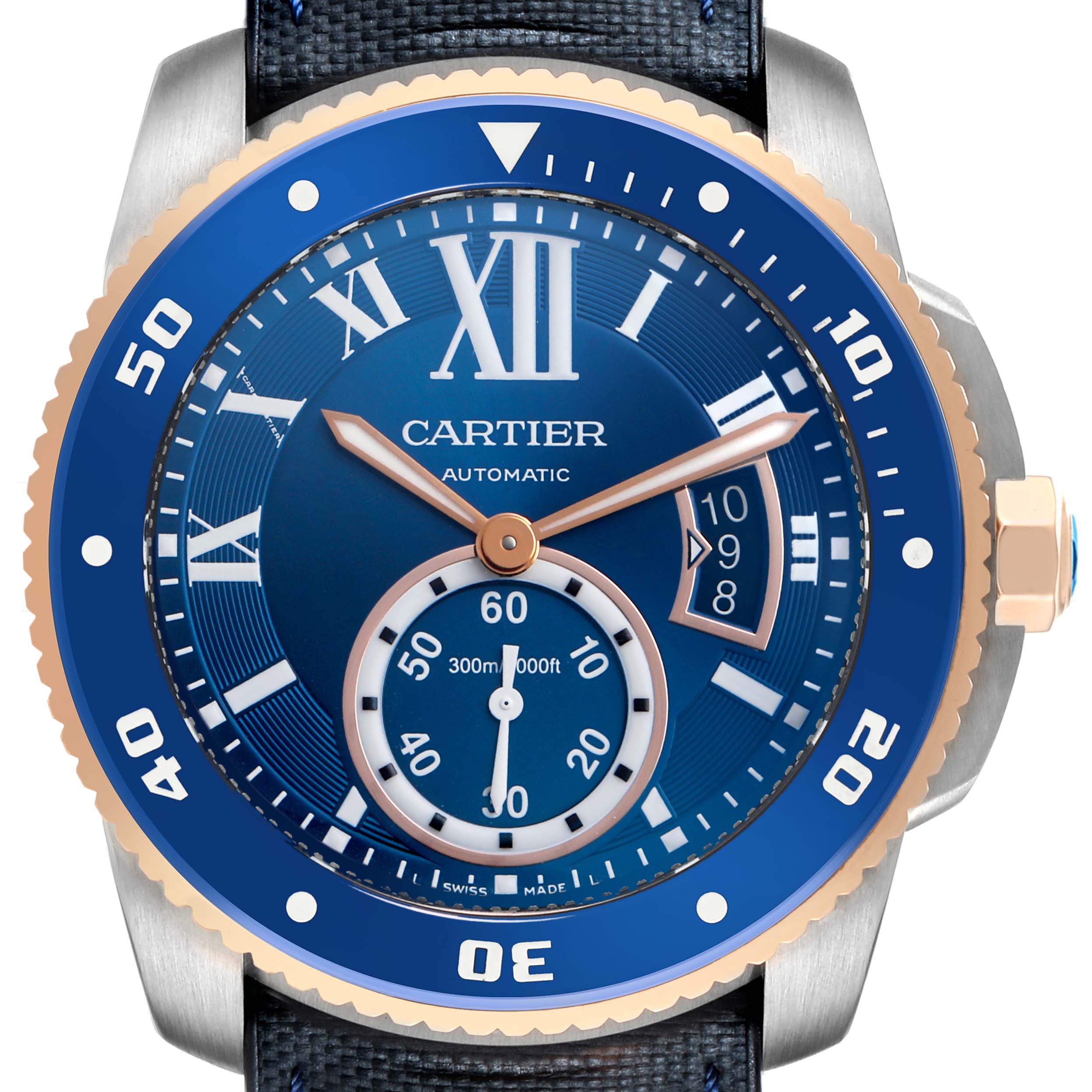 The image shows a front view of the Calibre de Cartier watch face, highlighting its blue dial, bezel, and hands.