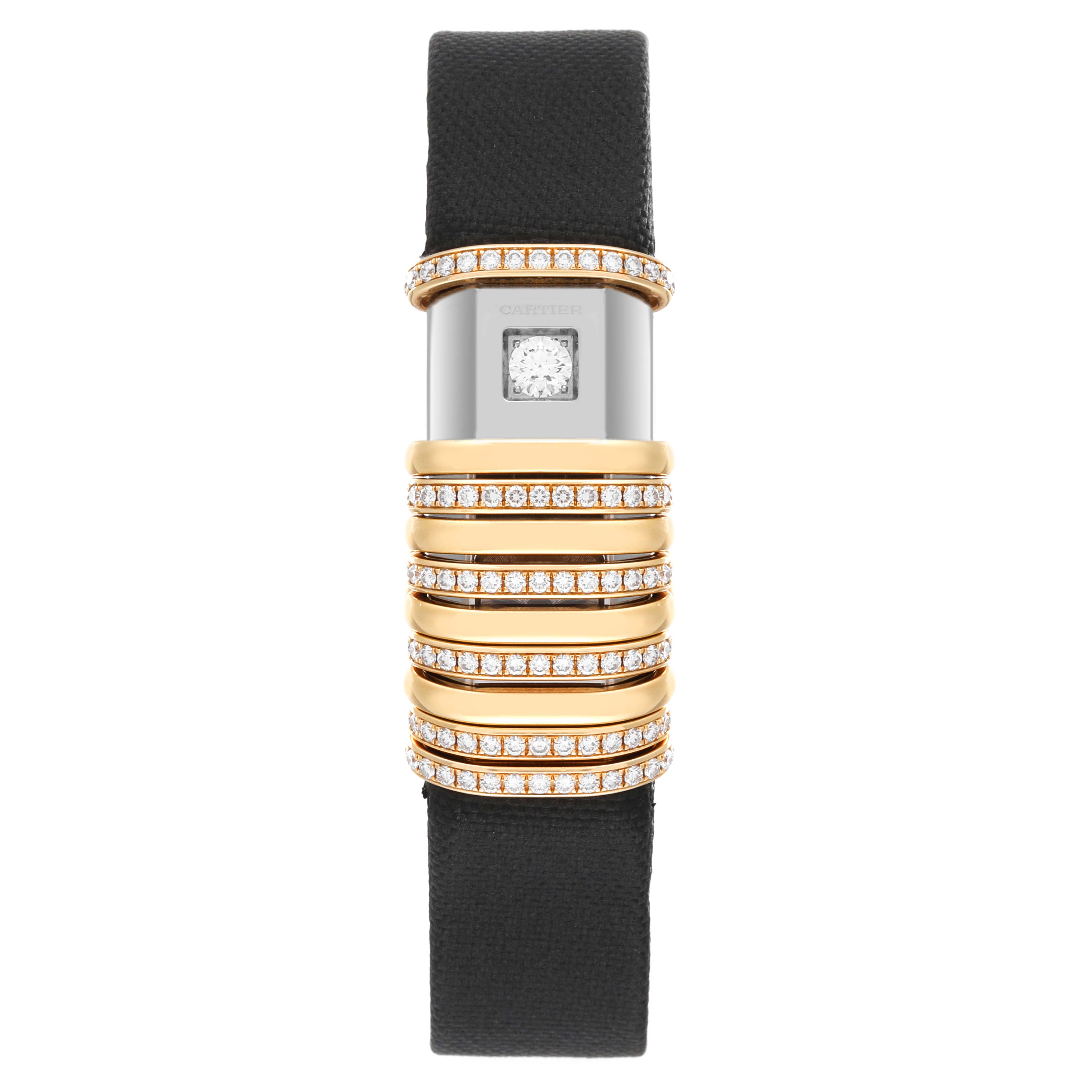 The image shows a Declaration model by Cartier from a front angle, highlighting the watch face and black leather strap adorned with diamond rings.