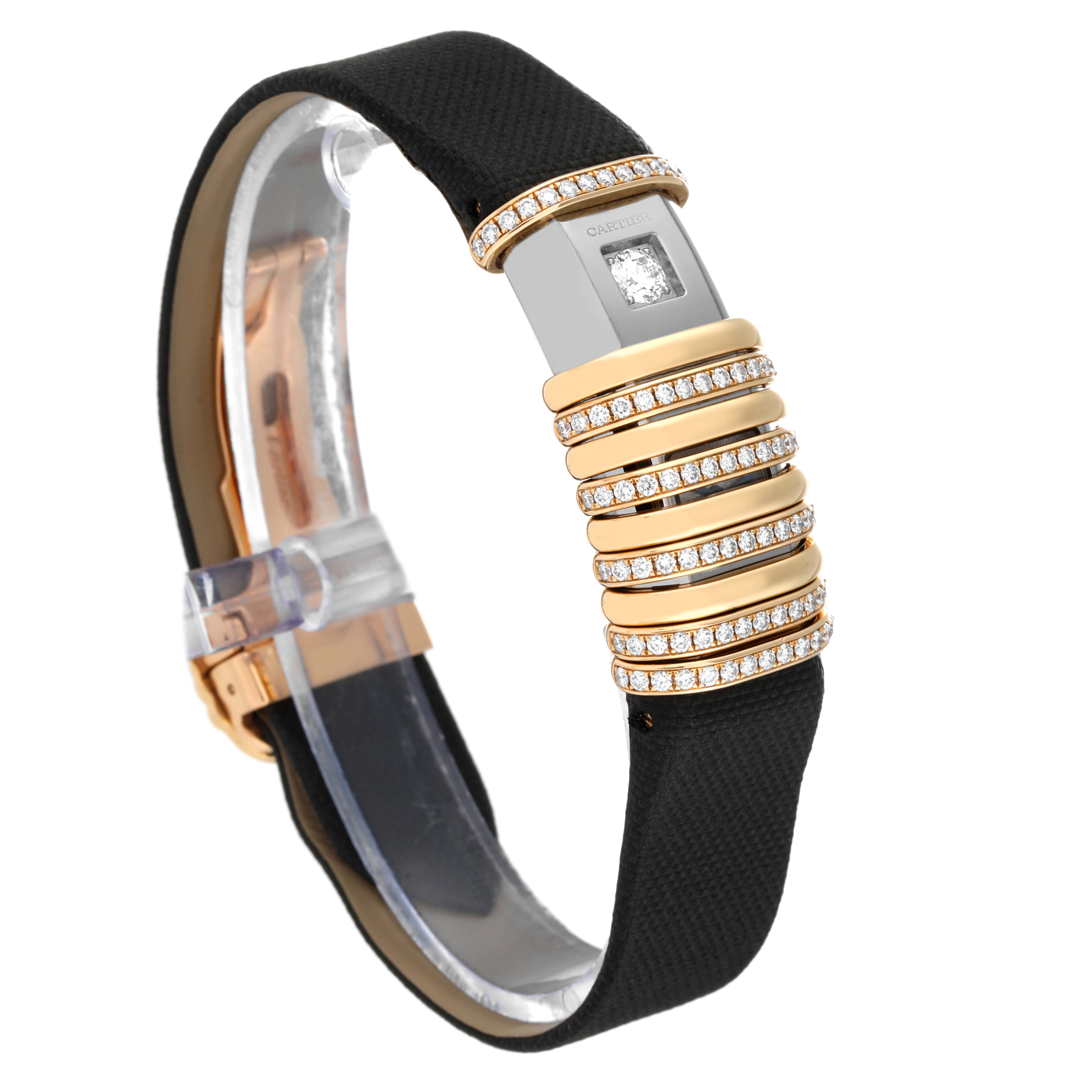 The Cartier Declaration WT000150 Women's Titanium Silver Dial WT000150 Women's Titanium Silver Dial watch is shown from a side angle, highlighting its diamond-studded rings and black strap.