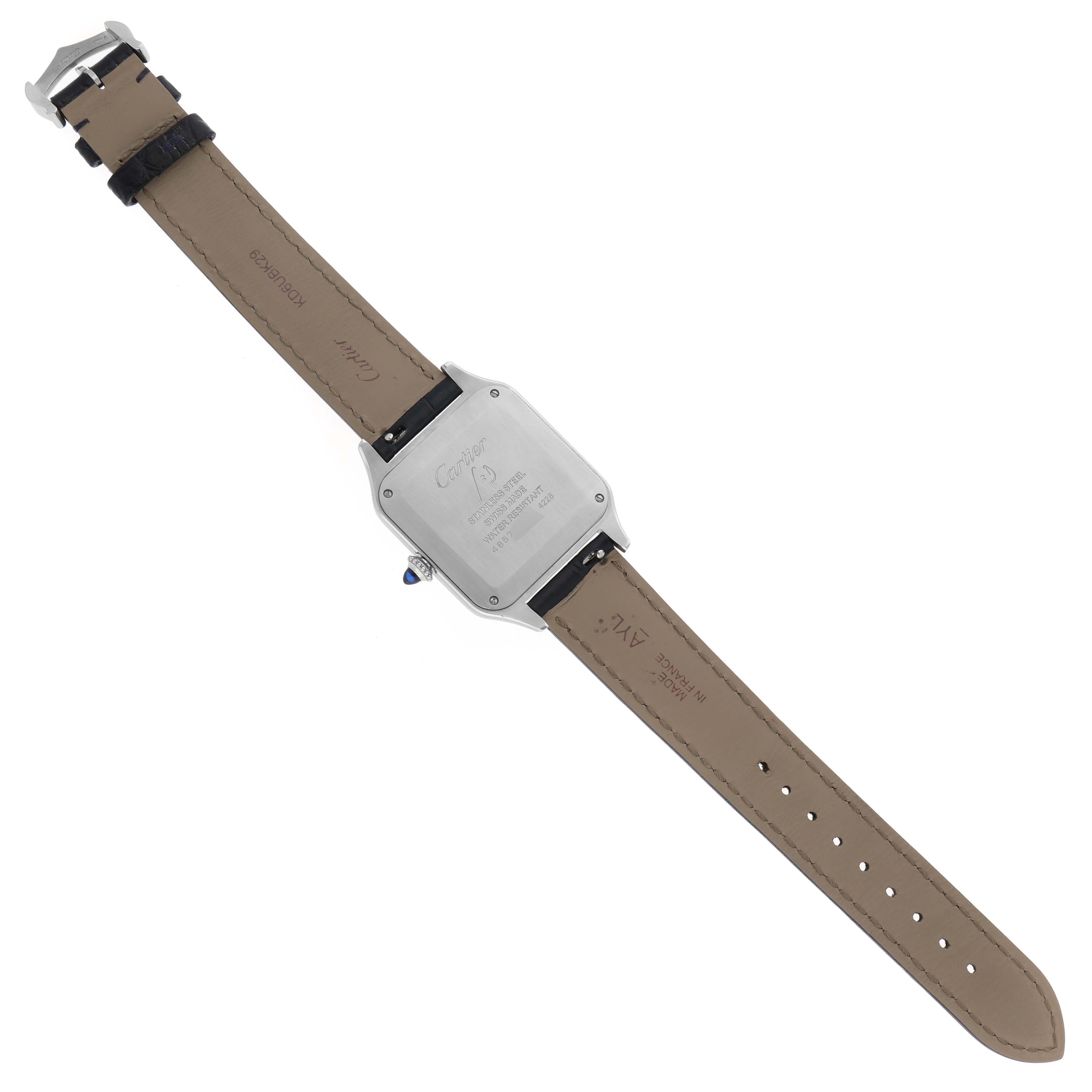 This image shows the back case and the leather strap of a Cartier Santos Dumont WSSA0022 Men's Stainless Steel Silver Dial WSSA0022 Men's Stainless Steel Silver Dial model watch laid flat.