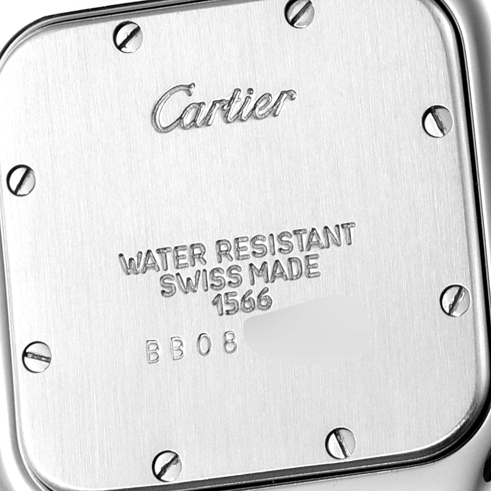 The image shows the back case of a Santos model watch by Cartier, indicating water resistance and Swiss-made craftsmanship.