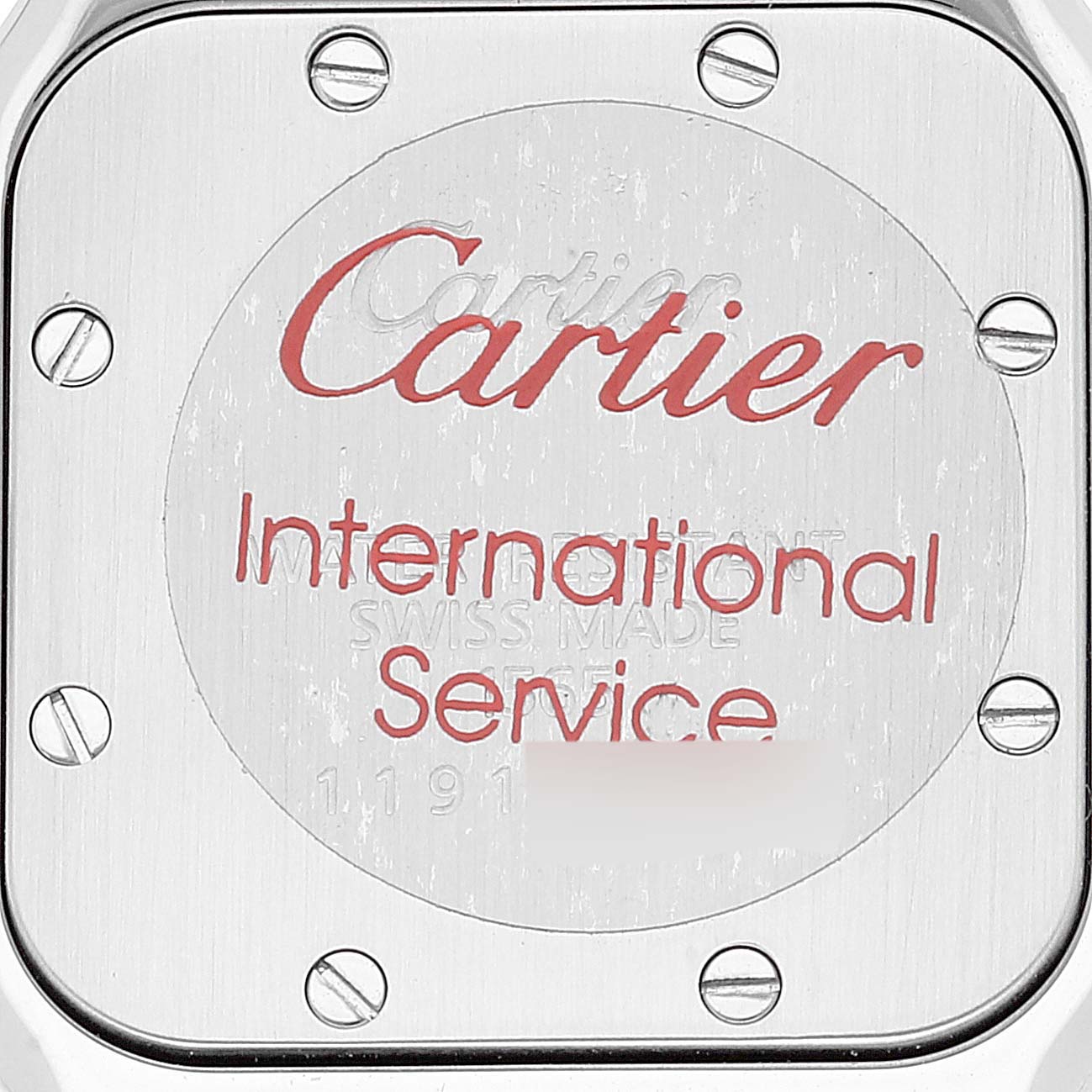 The image shows the back case of a Cartier Santos W20056D6 Women's Stainless Steel Silver Dial W20056D6 Women's Stainless Steel Silver Dial watch with inscriptions related to international service.