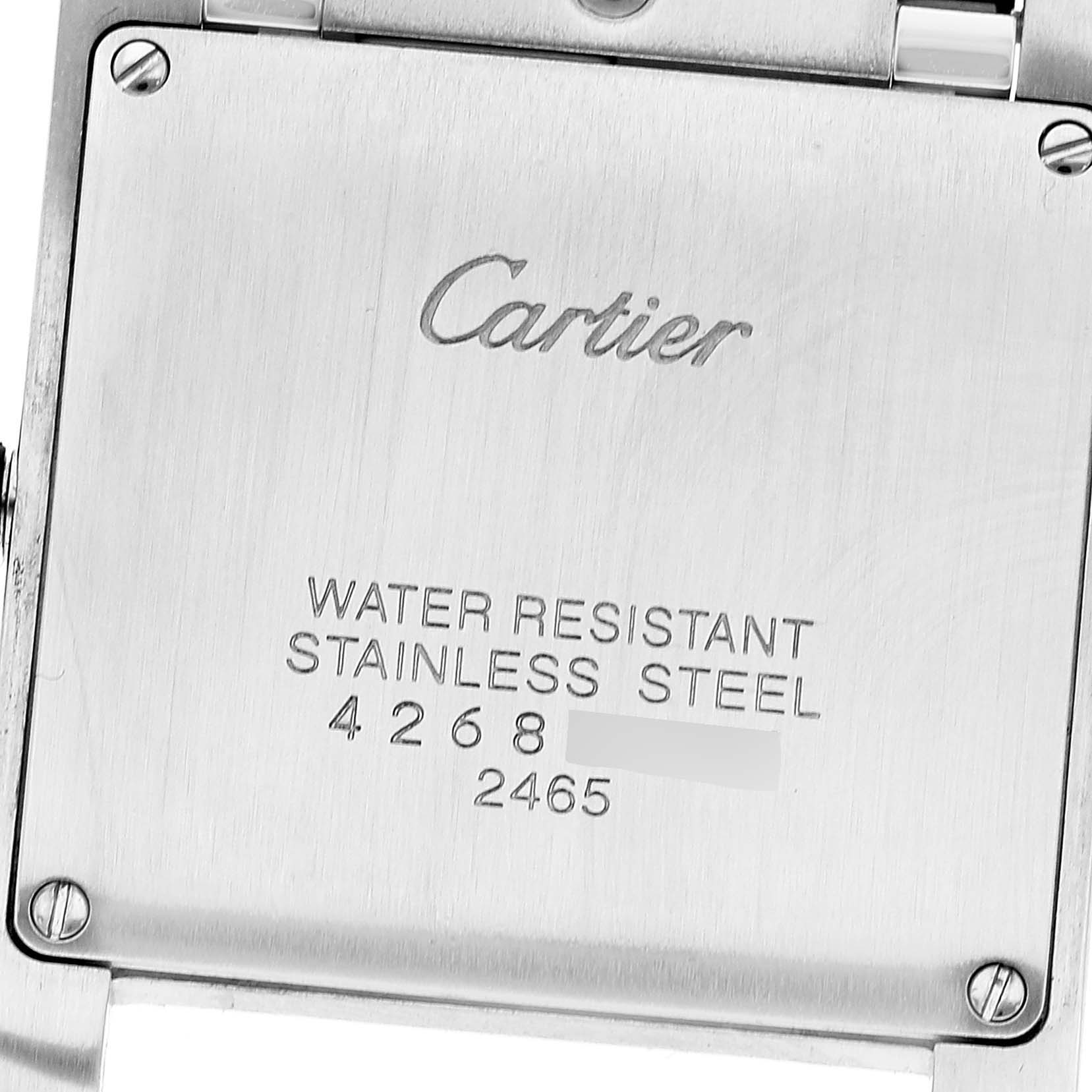 The image shows the stainless steel backplate of the Cartier Tank Francaise W51012Q4 Women's Steel and Gold (two tone) Silver Dial W51012Q4 Women's Steel and Gold (two tone) Silver Dial watch, displaying brand engraving and water resistance details.