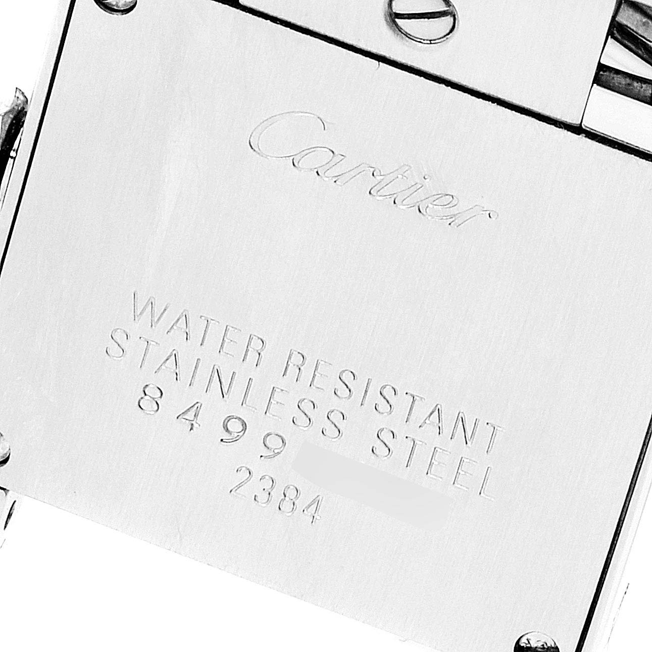 The image shows a close-up of the back case of a Cartier Tank Francaise W51028Q3 Women's Stainless Steel Mother of Pearl Dial W51028Q3 Women's Stainless Steel Mother of Pearl Dial watch, highlighting the brand engraving and material details.