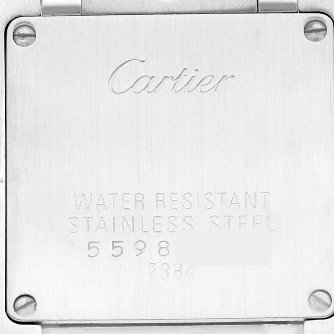 The image shows the stainless steel back casing of a Cartier Tank Francaise W51027Q4 Women's Steel and Gold (two tone) Mother of Pearl Dial W51027Q4 Women's Steel and Gold (two tone) Mother of Pearl Dial watch, including engravings and screws.