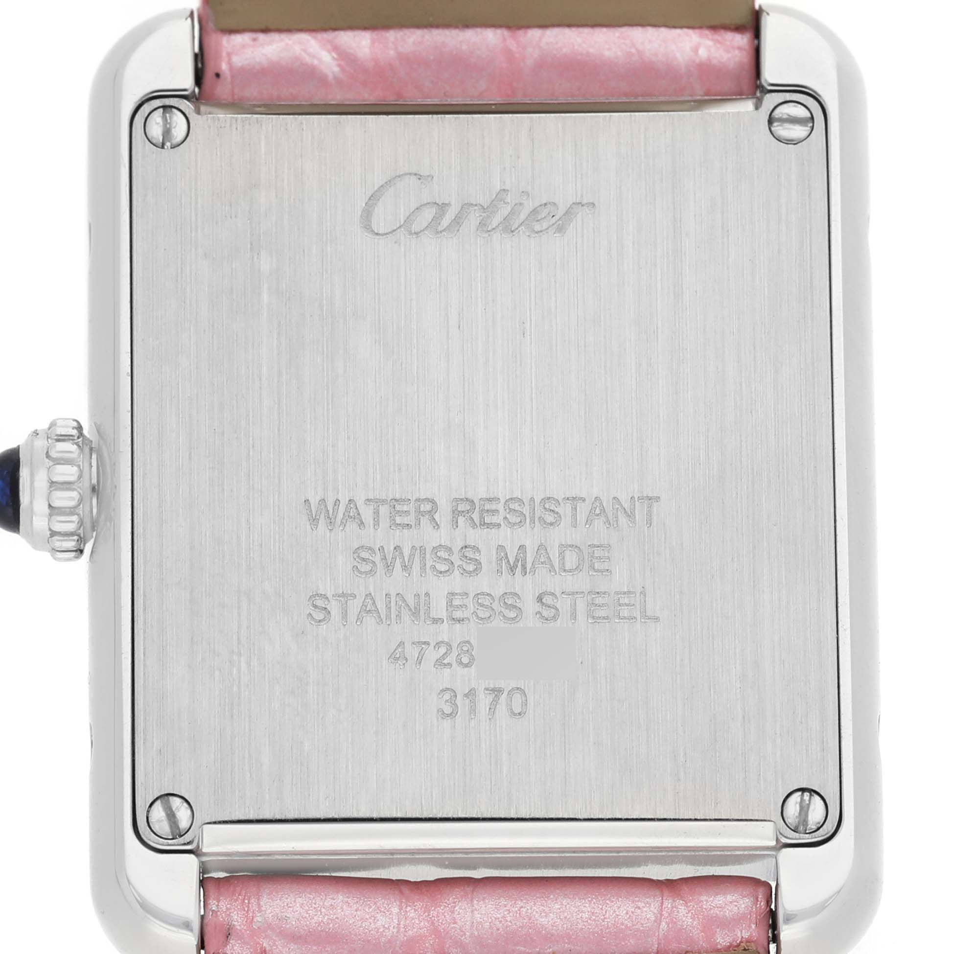 The image shows the backside of the Cartier Tank Solo WSTA0030 Women's Stainless Steel Silver Dial watch, displaying its stainless steel case and inscriptions.