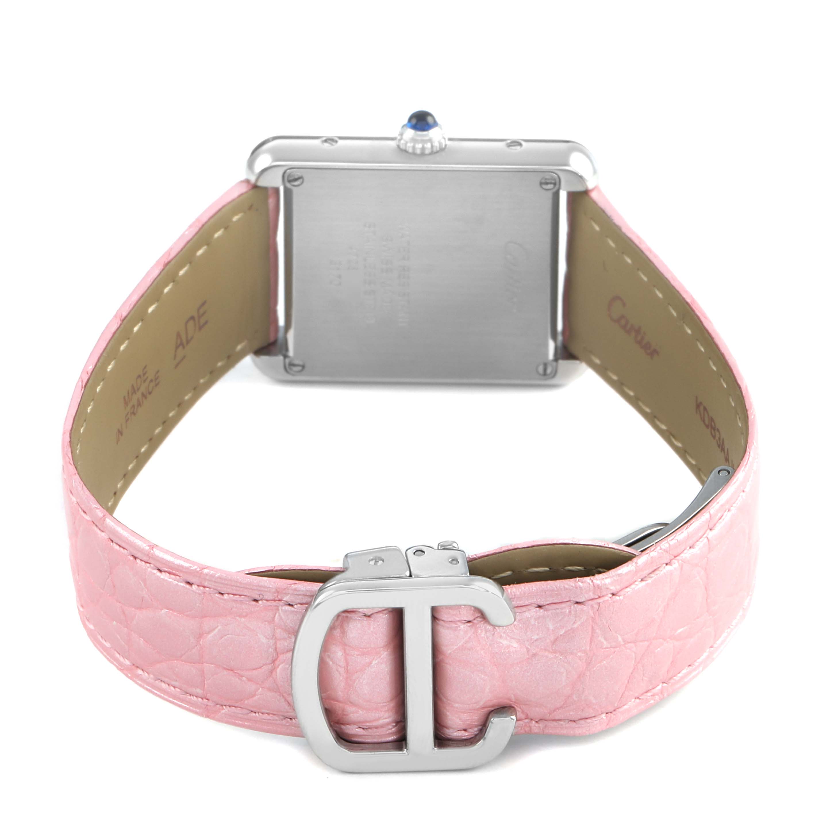 The image shows the back of a Cartier Tank Solo WSTA0030 Women's Stainless Steel Silver Dial watch with a pink leather strap and visible buckle.