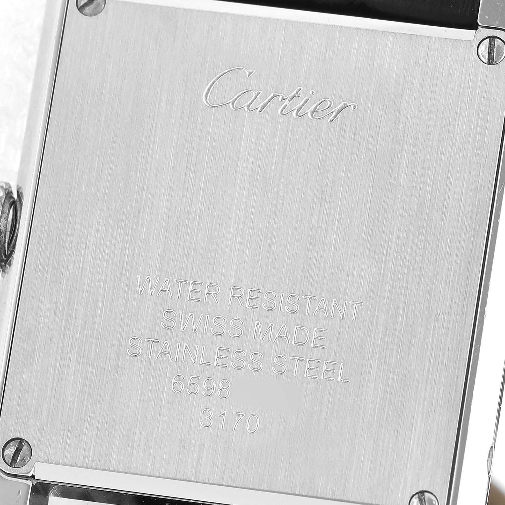 The image shows the back case of the Cartier Tank Solo WSTA0030 Women's Stainless Steel Silver Dial watch, highlighting the brand engraving and specifications.