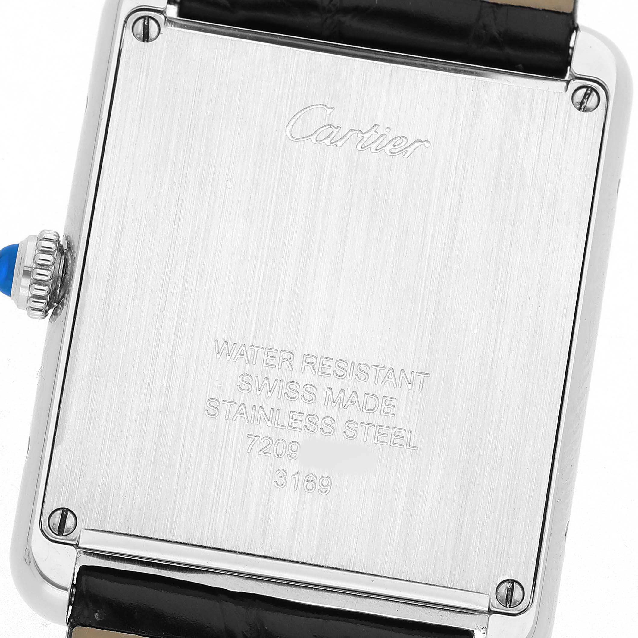 The image shows the back of the Cartier Tank Solo W5200003 Men's Stainless Steel Silver Dial watch, highlighting its engraved details and crown from the rear angle.
