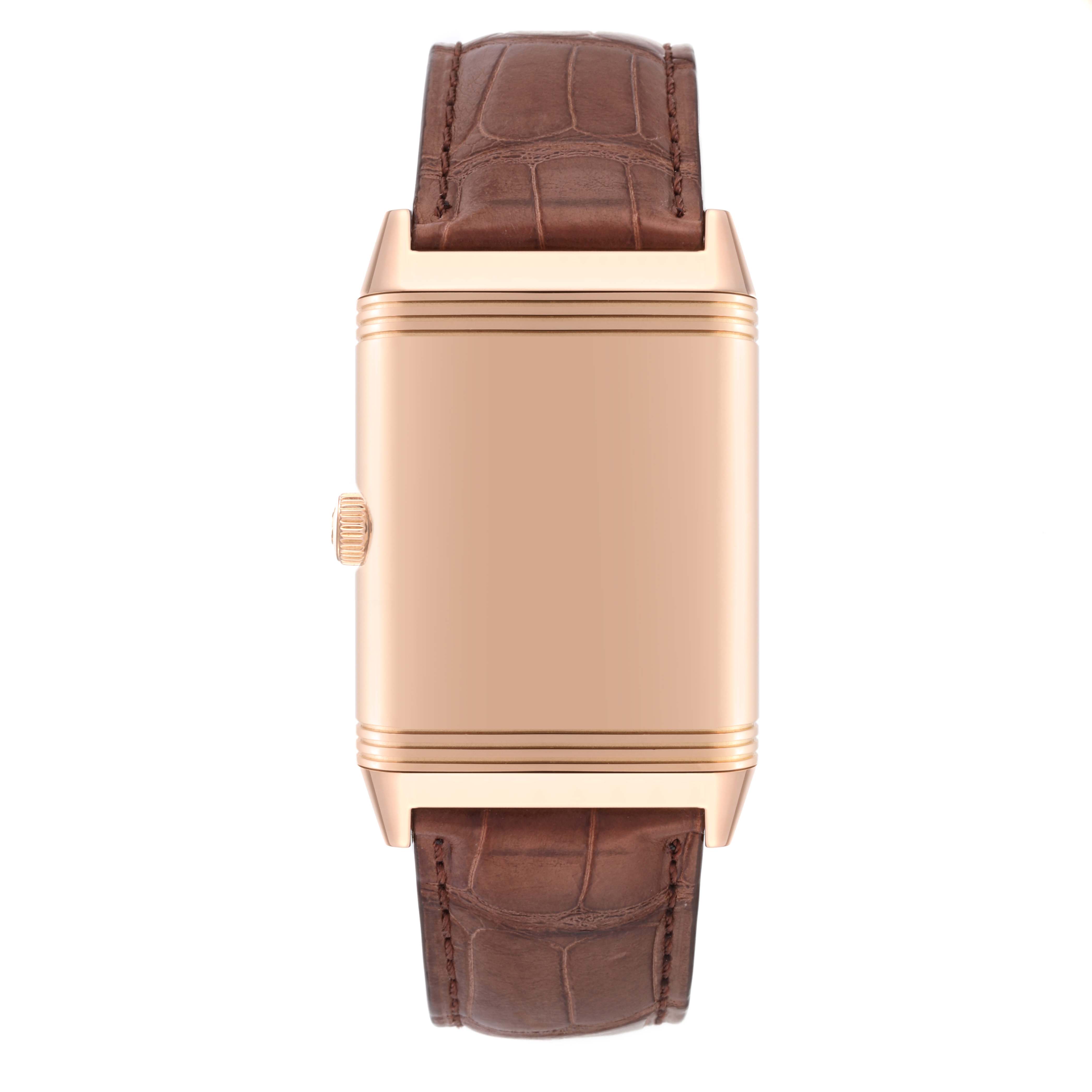 The image shows a top view of the Jaeger LeCoultre Reverso Q3732523 Men's Rose Gold White Dial Q3732523 Men's Rose Gold White Dial model watch with a brown leather strap and a closed case.