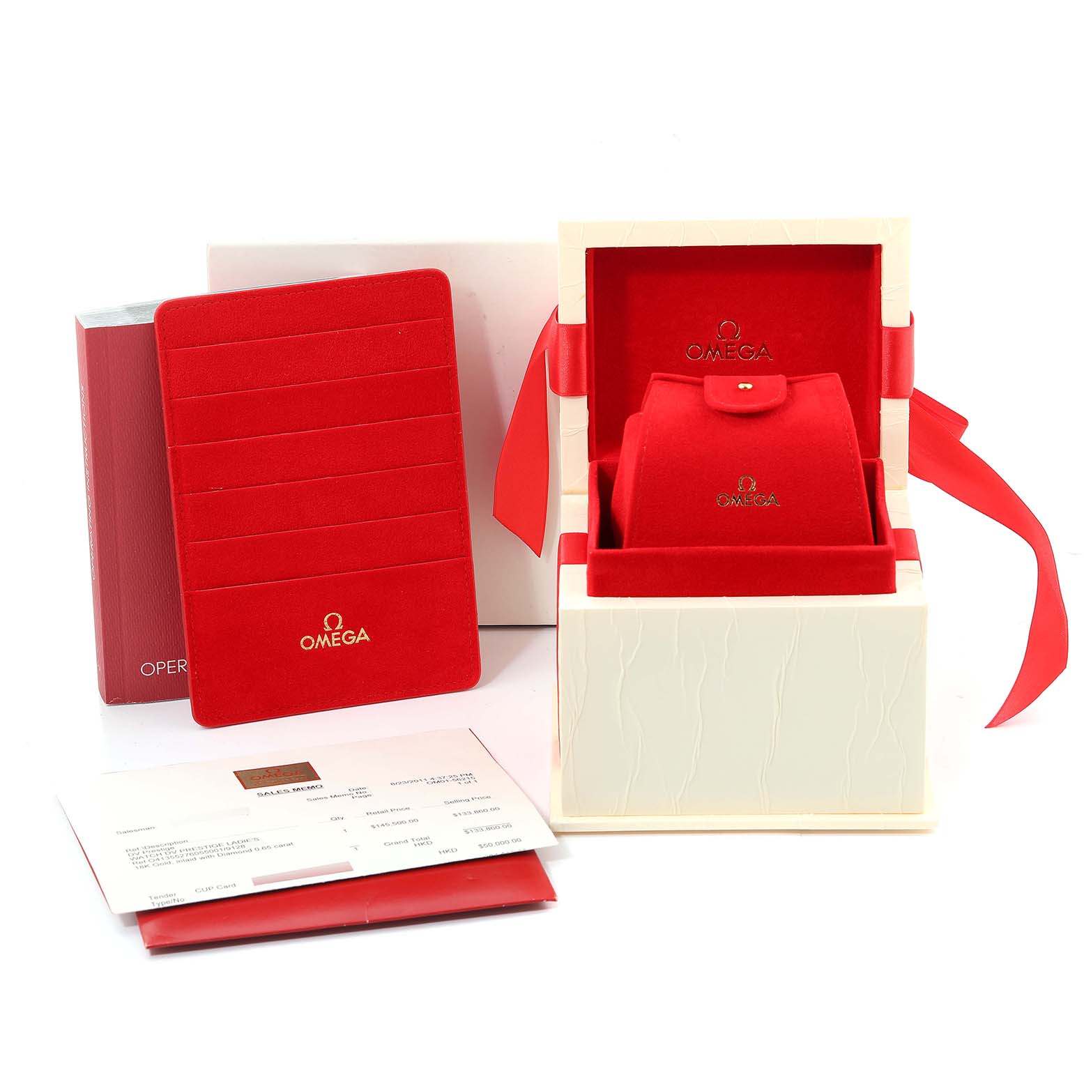 The image shows the packaging and accessories for the Omega 413.55.27.60.55.001 Women's Yellow Gold Mother of Pearl Dial 413.55.27.60.55.001 Women's Yellow Gold Mother of Pearl Dial DeVille Prestige Yellow Gold Diamond Ladies Watch 413.55.27.60.55.001.