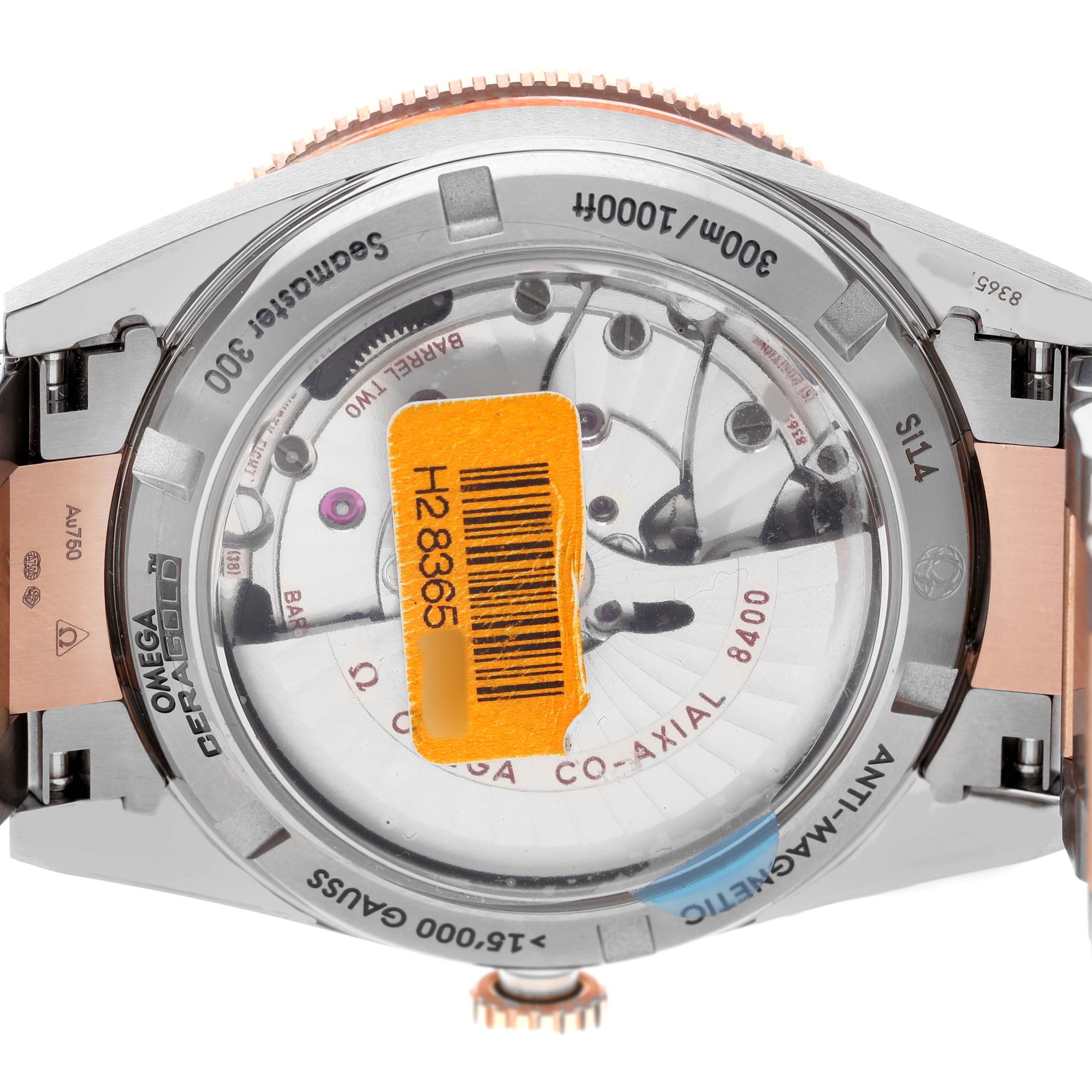 The image shows the back of the Omega Seamaster 233.60.41.21.03.001 Men's Titanium Blue Dial, highlighting the Co-Axial 8400 movement and transparent case back.