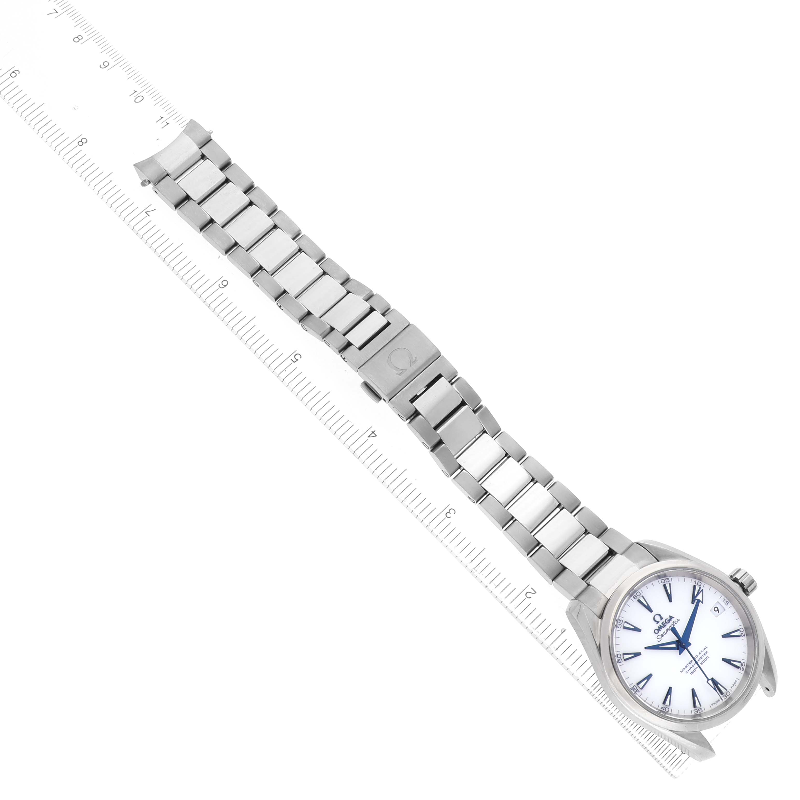 The Omega Seamaster 231.90.39.21.04.001 Men's Titanium White Dial watch is shown at a diagonal angle, displaying the full watch face and metal bracelet alongside a ruler.