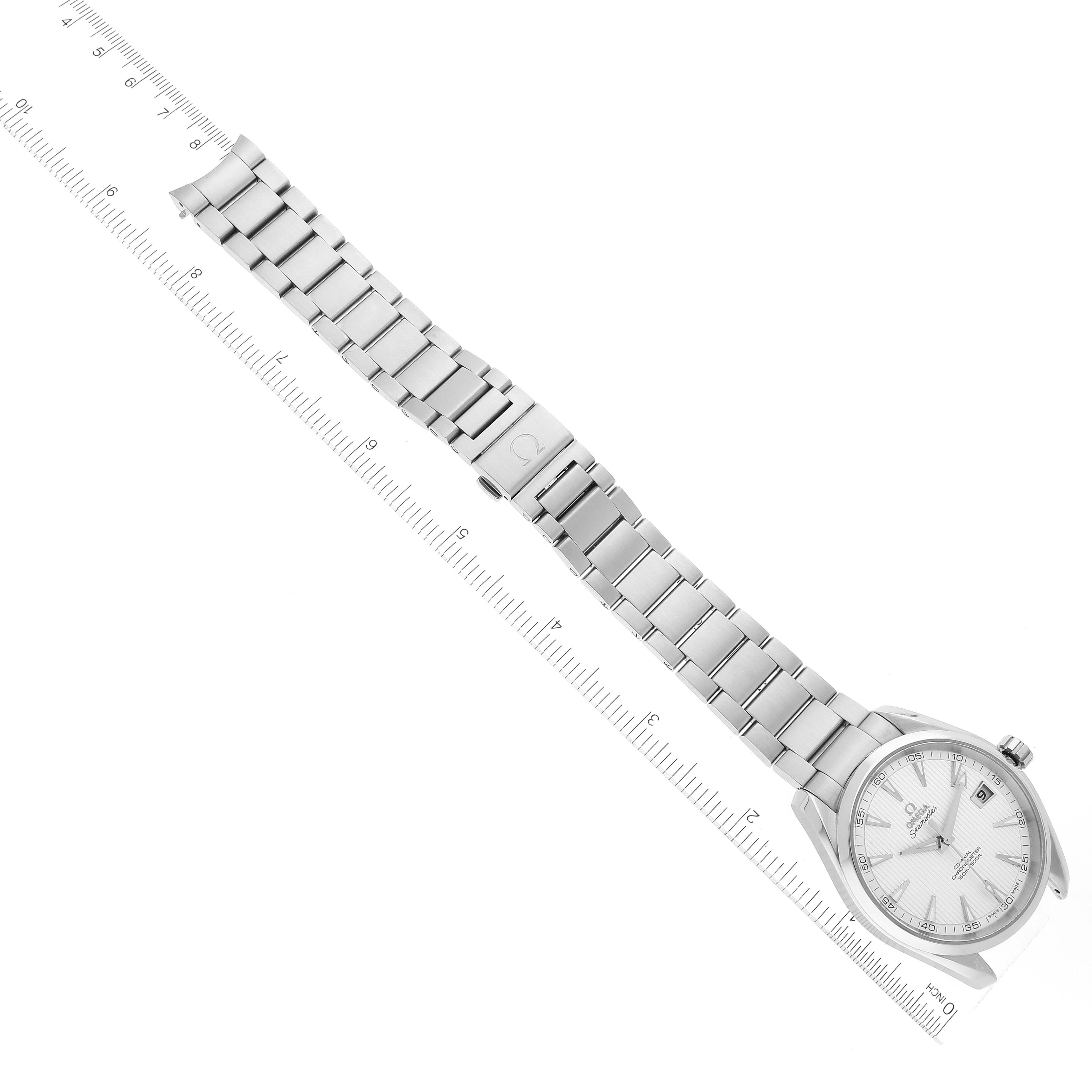 The image shows an Omega Aqua Terra 231.10.42.21.02.001 Men's Stainless Steel Silver Dial 231.10.42.21.02.001 Men's Stainless Steel Silver Dial watch laid out flat next to a ruler, highlighting the bracelet and face at an angled top-down view.